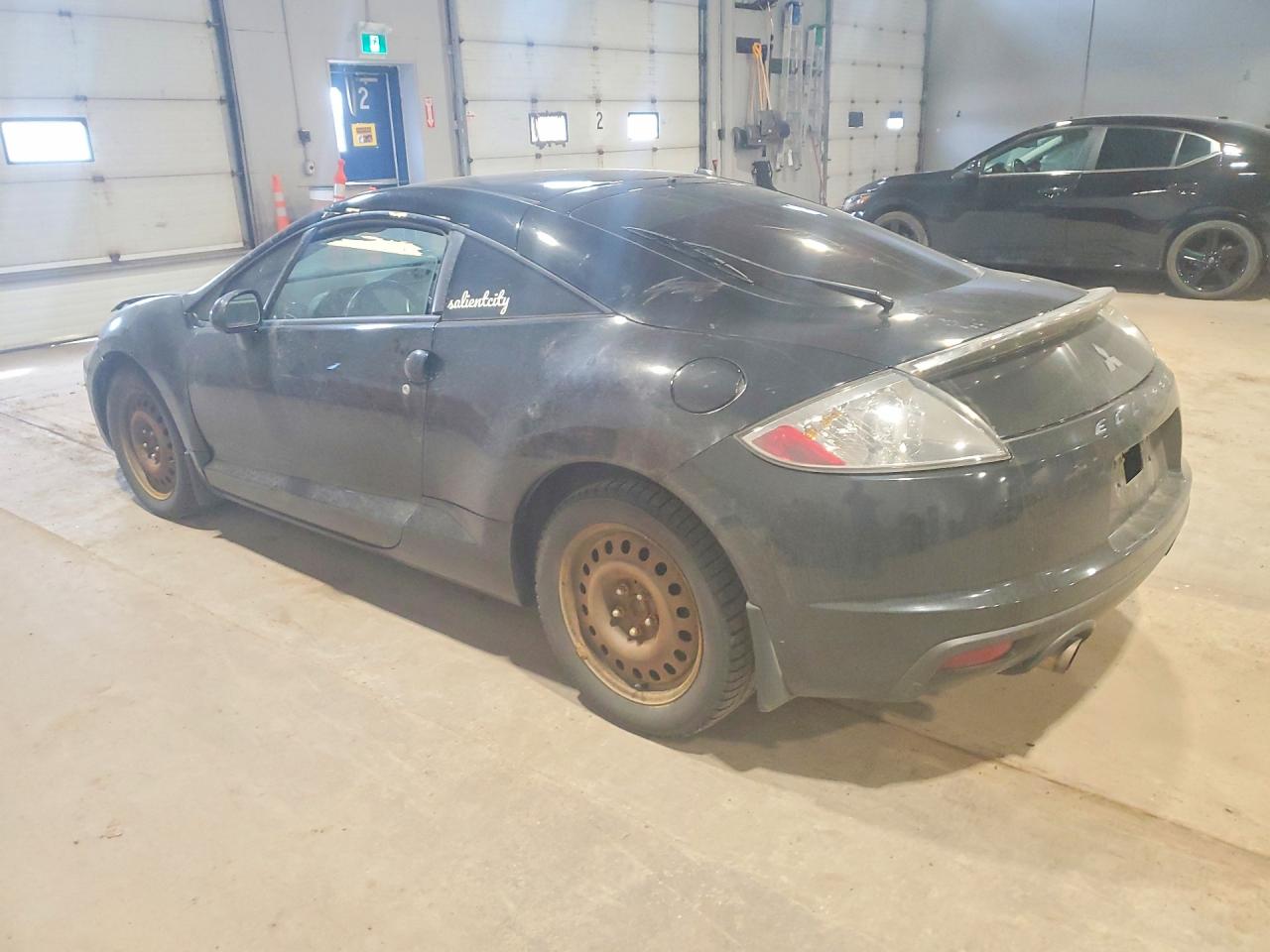 4A31K3DT9CE601304 · 2012 MITSUBISHI ECLIPSE · 2/13