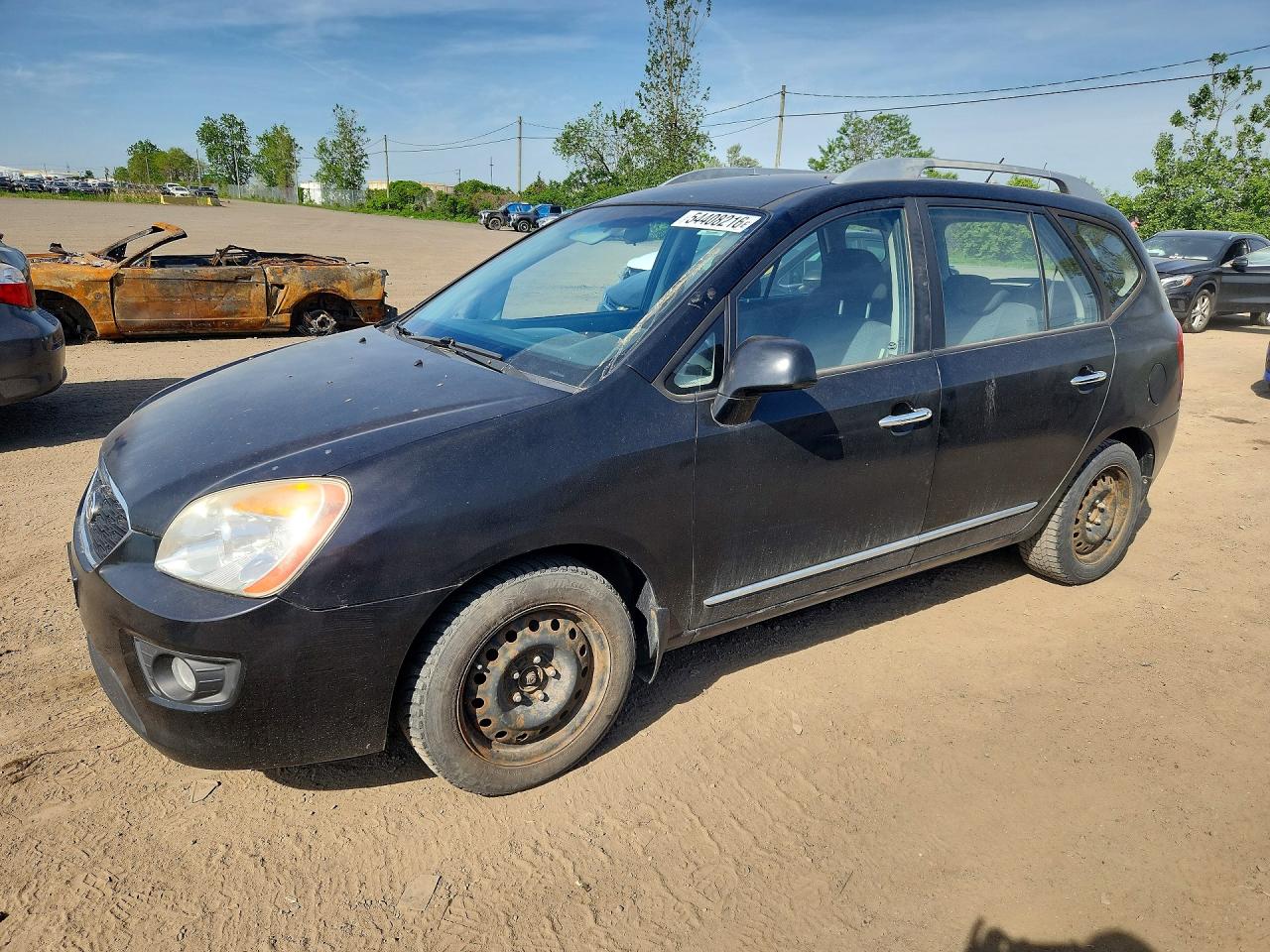 KNAHH8C83B7363895 · 2011 KIA RONDO