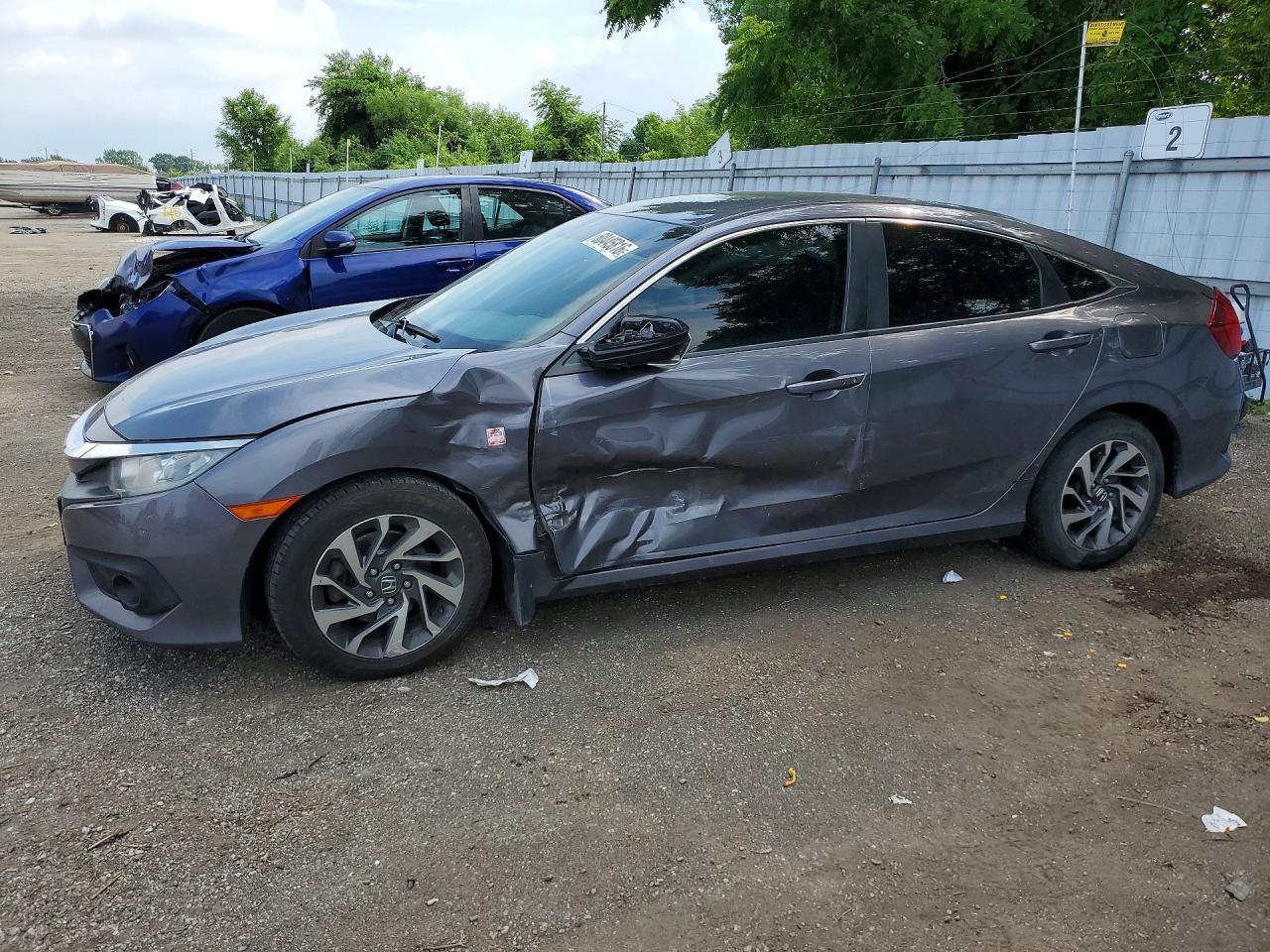 2HGFC2F66JH040560 · 2018 HONDA CIVIC