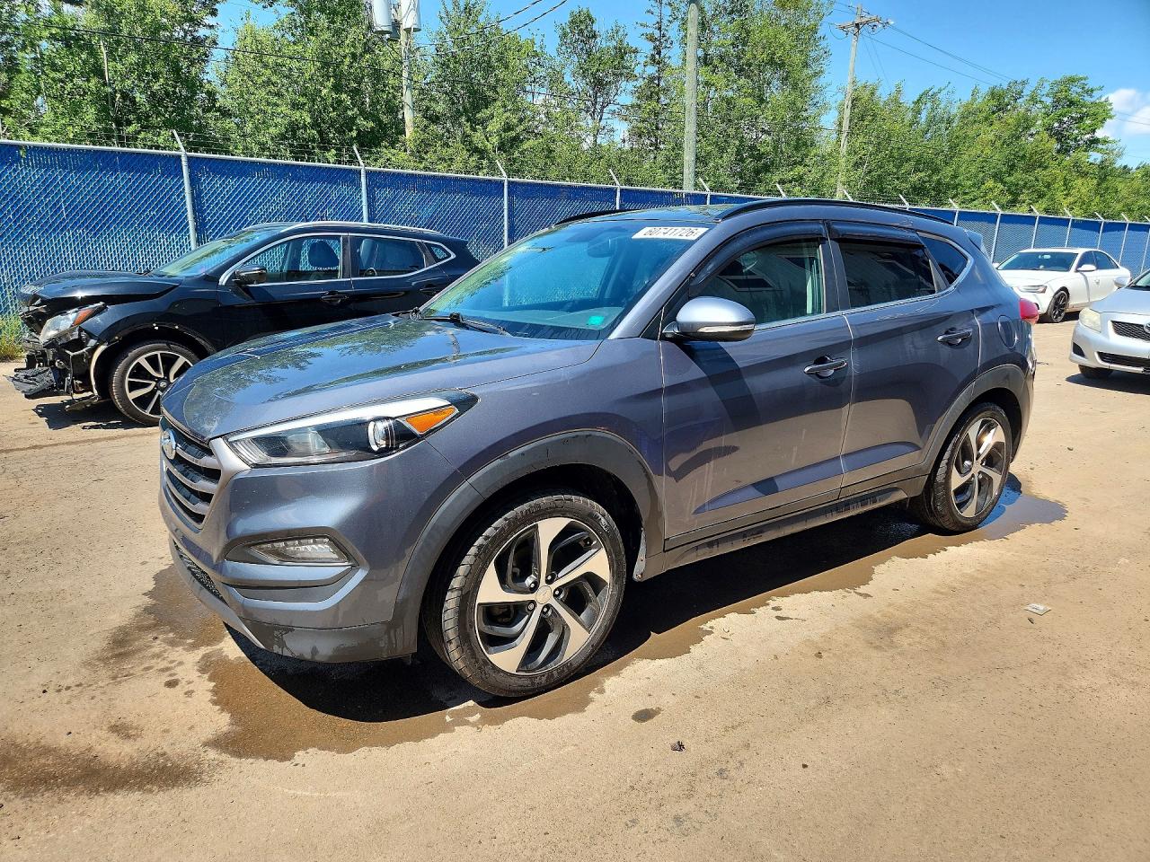 KM8J3CA22GU033884 · 2016 HYUNDAI TUCSON