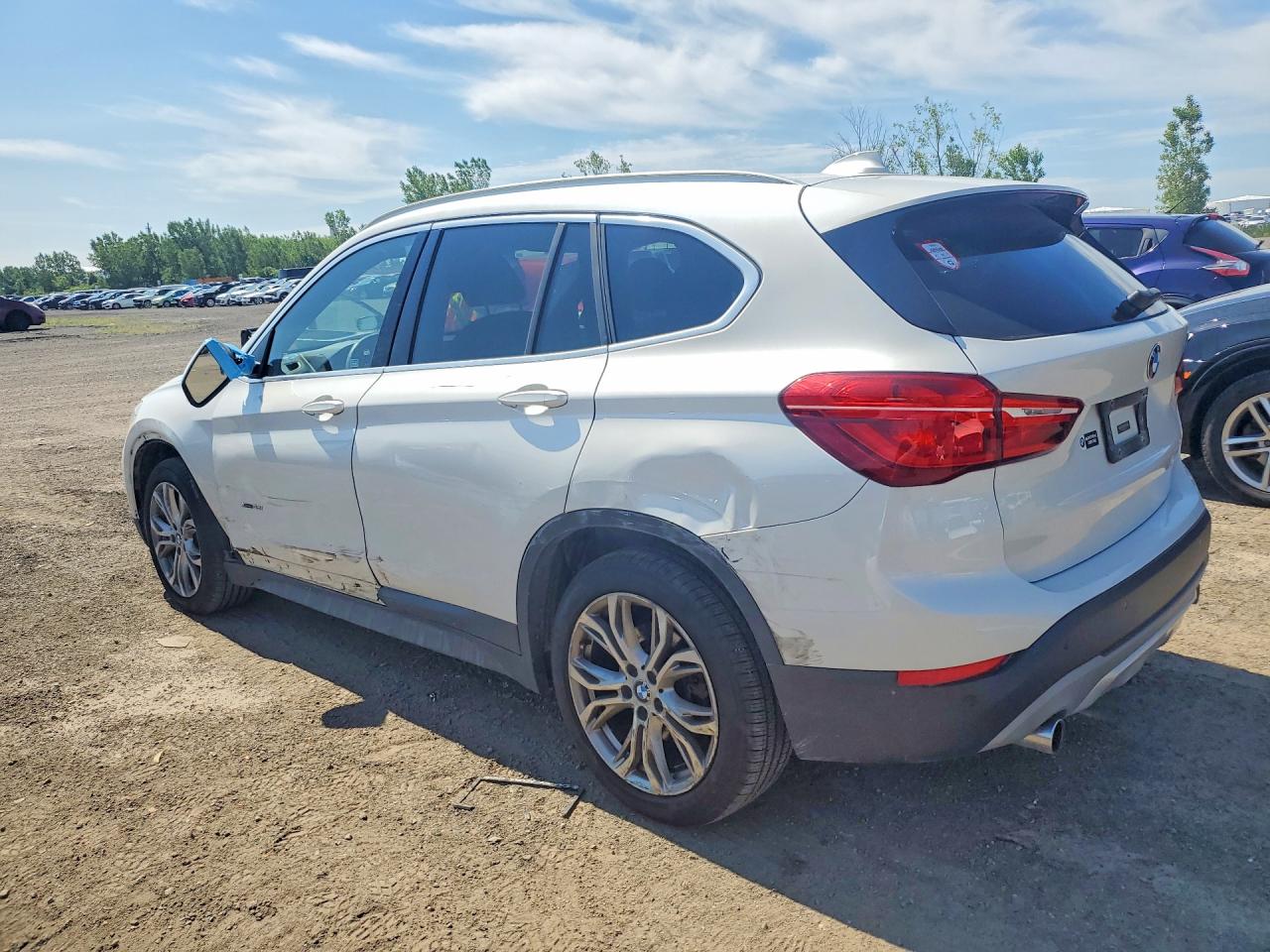 WBXHT3C34J5F91283 · 2018 BMW X1 · 2/13