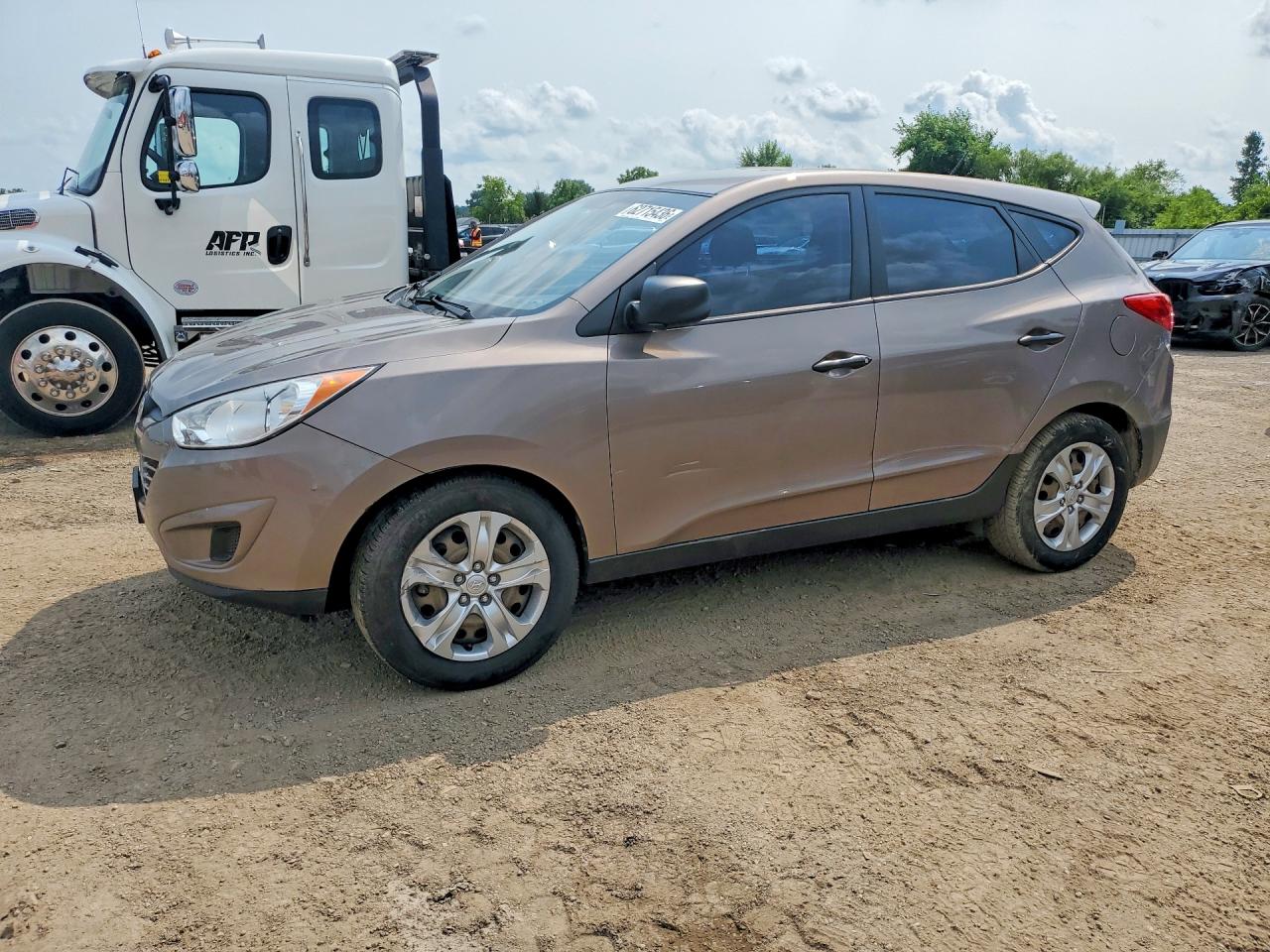 KM8JT3AB8CU504608 · 2012 HYUNDAI TUCSON