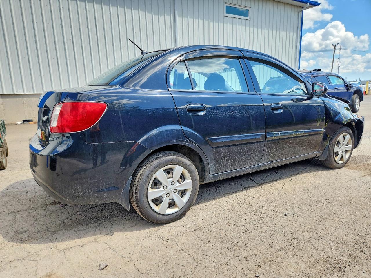 KNADH4B38A6674143 · 2010 KIA RIO · 3/11