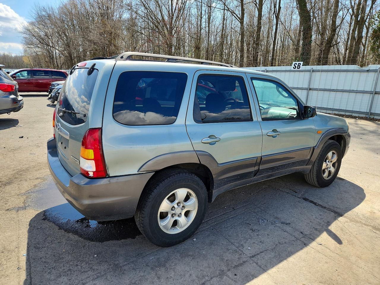 4F2YZ94183KM18587 · 2003 MAZDA TRIBUTE · 3/13