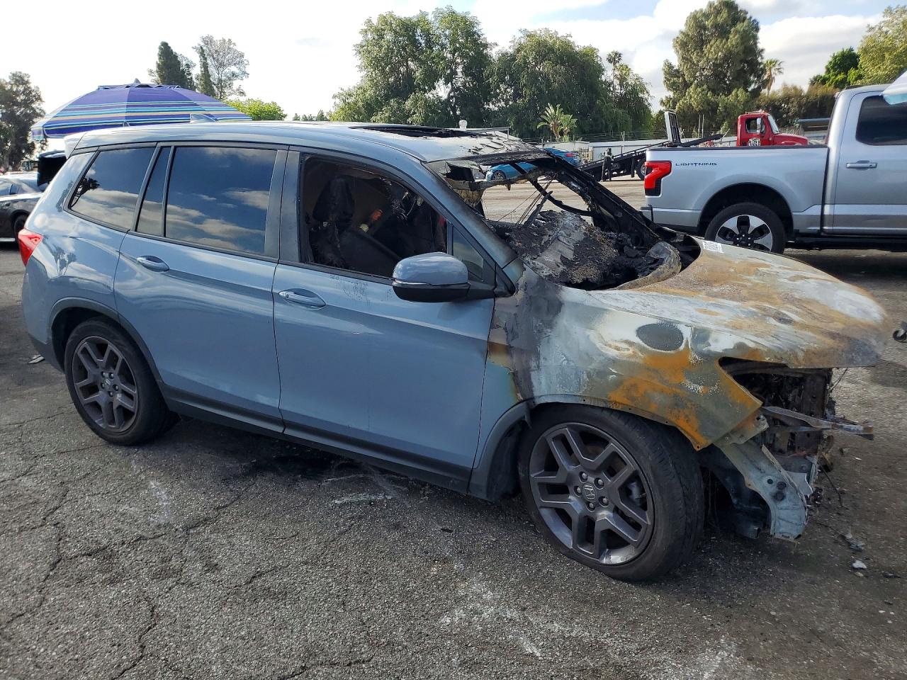 5FNYF7H55NB002765 · 2022 HONDA PASSPORT · 4/13
