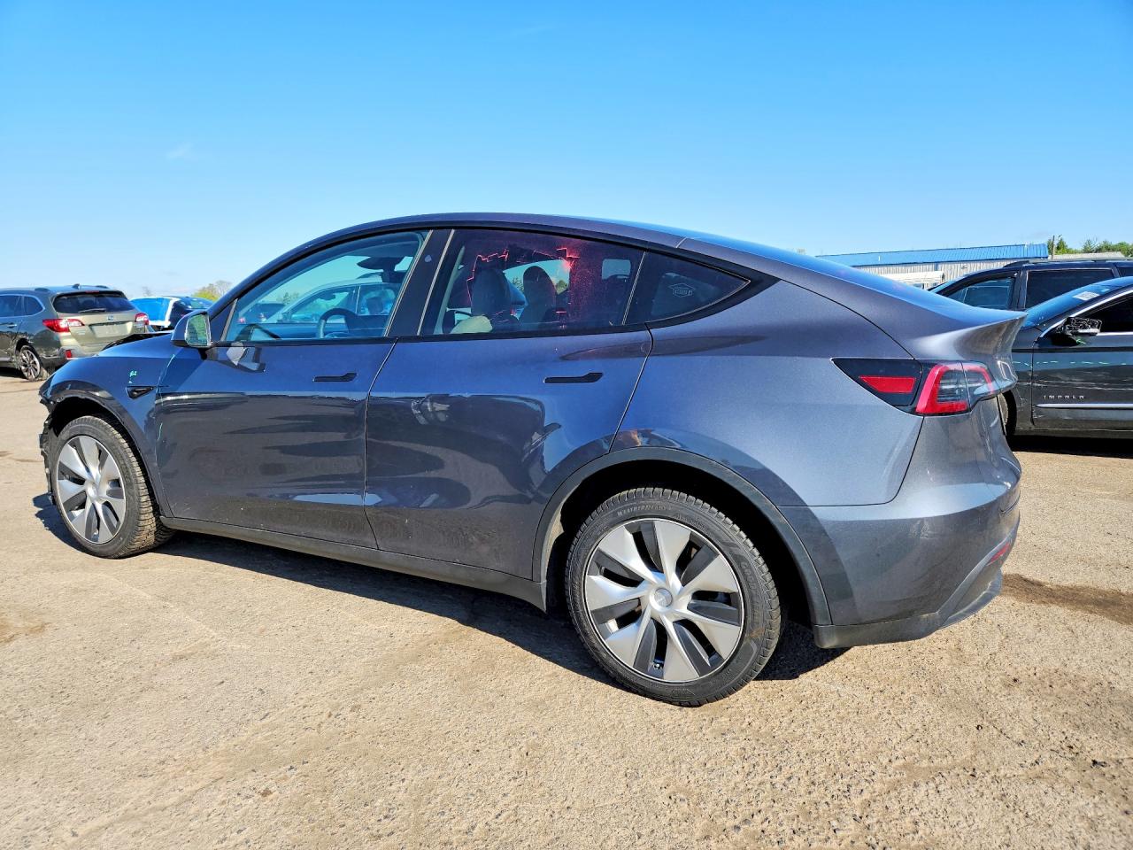7SAYGDEE4PF832210 · 2023 TESLA MODEL Y · 2/13