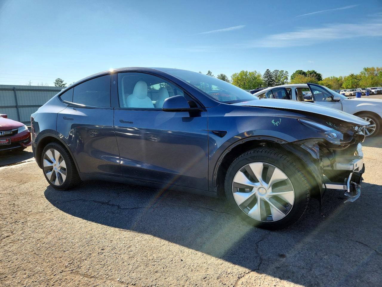 7SAYGDEE4PF832210 · 2023 TESLA MODEL Y · 4/13