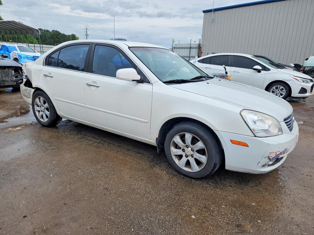 KNAGE124065073920 · 2006 KIA OPTIMA · 4/9