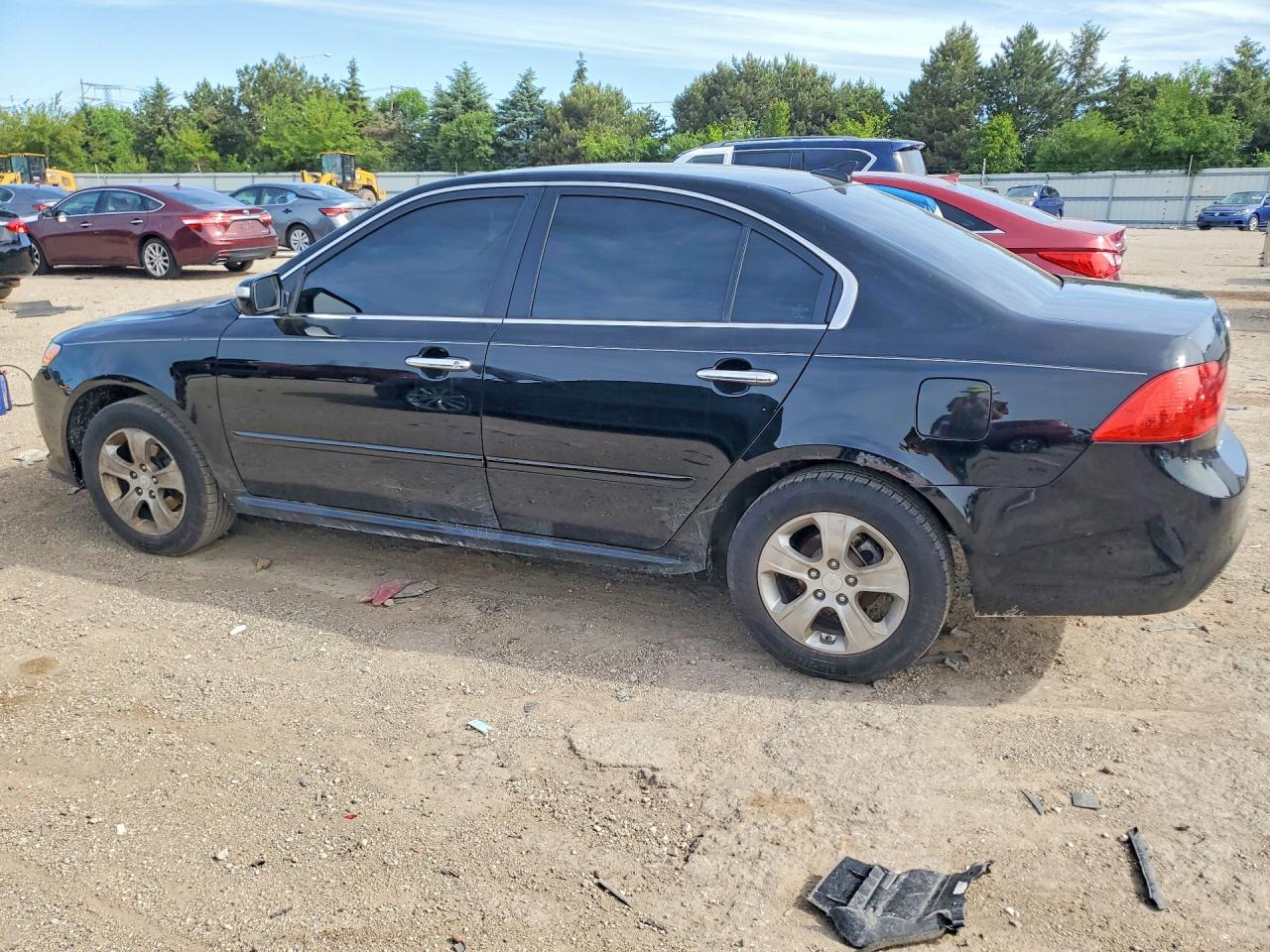 KNAGE228995324169 · 2009 KIA OPTIMA · 2/12