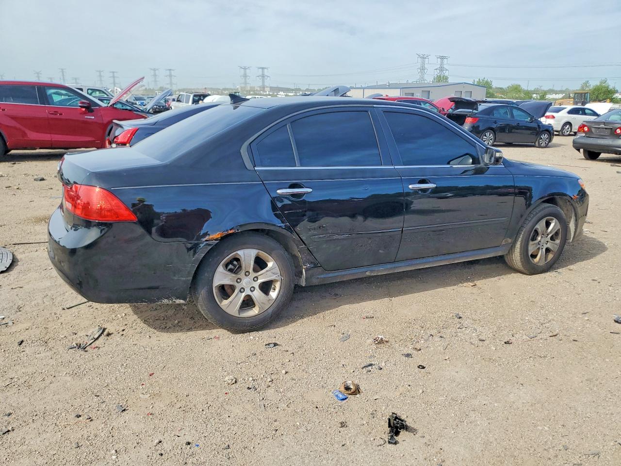 KNAGE228995324169 · 2009 KIA OPTIMA · 3/12
