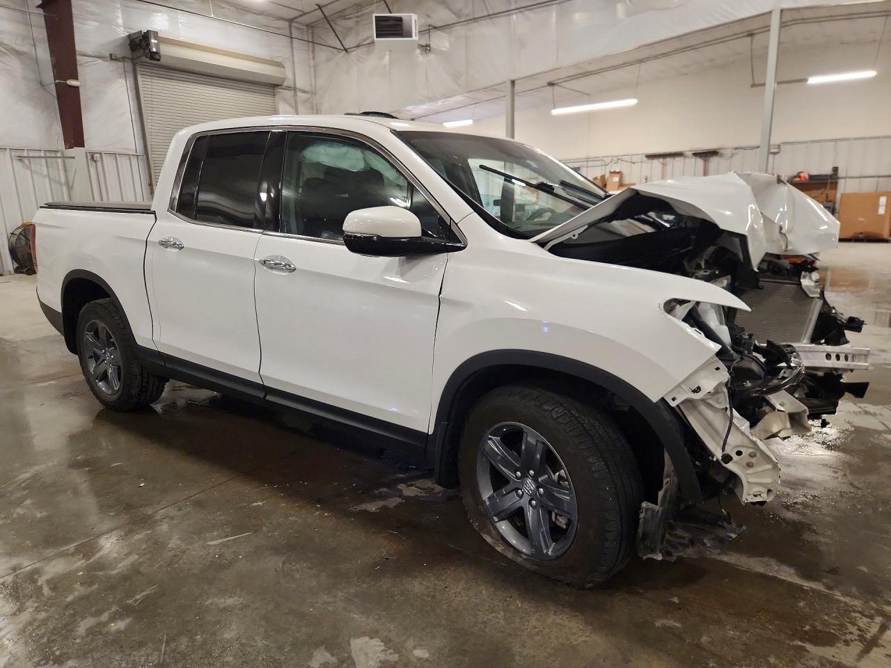 5FPYK3F75PB057655 · 2023 HONDA RIDGELINE · 4/12