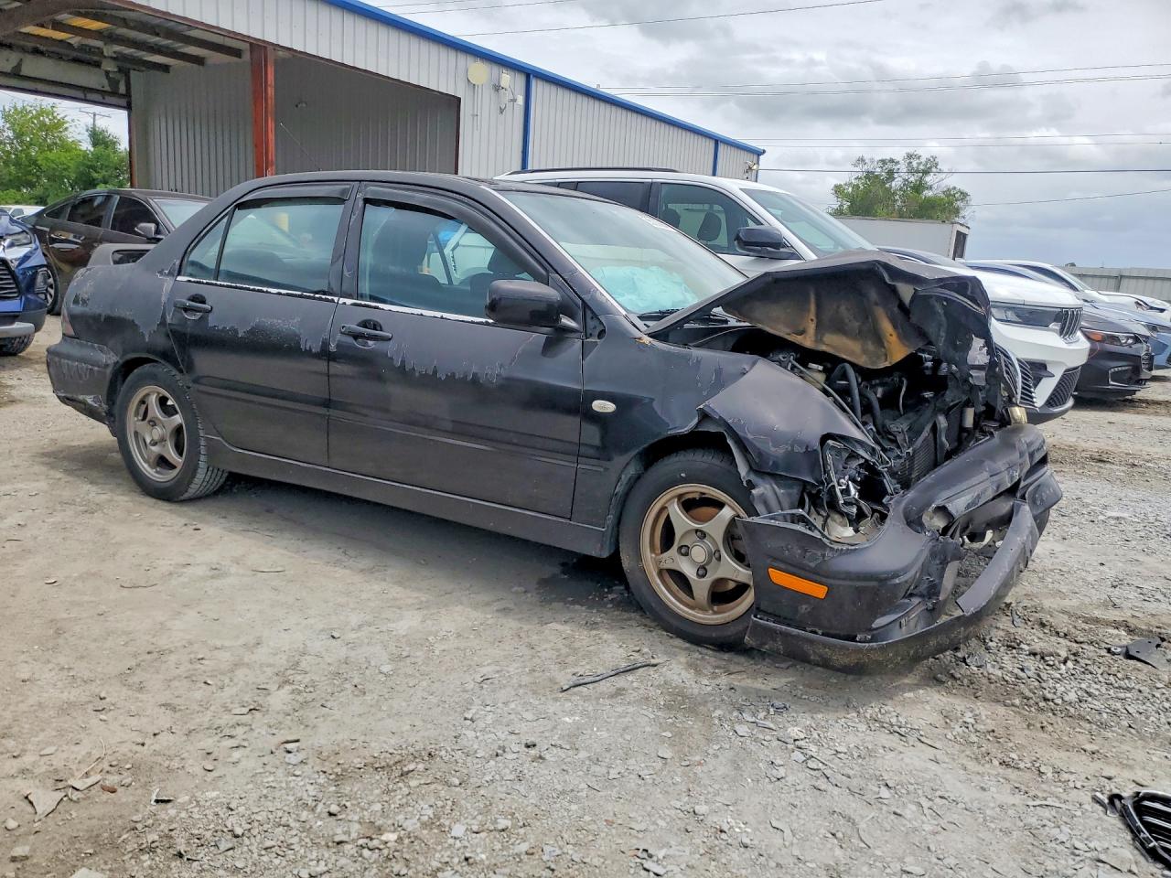 JA3AJ86E92U027064 · 2002 MITSUBISHI LANCER · 4/12