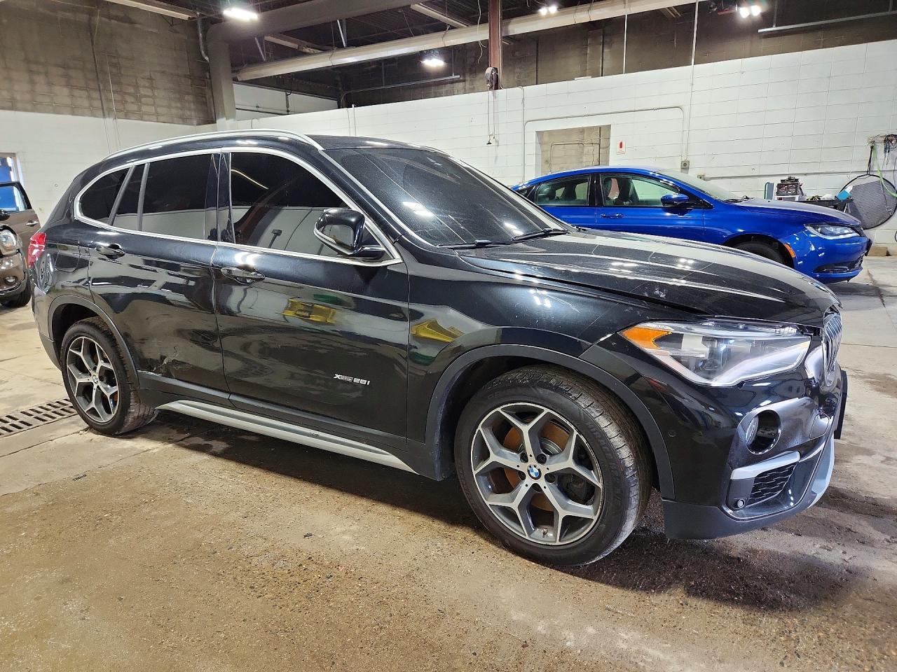 WBXHT3C30H5F86785 · 2017 BMW X1 · 4/13