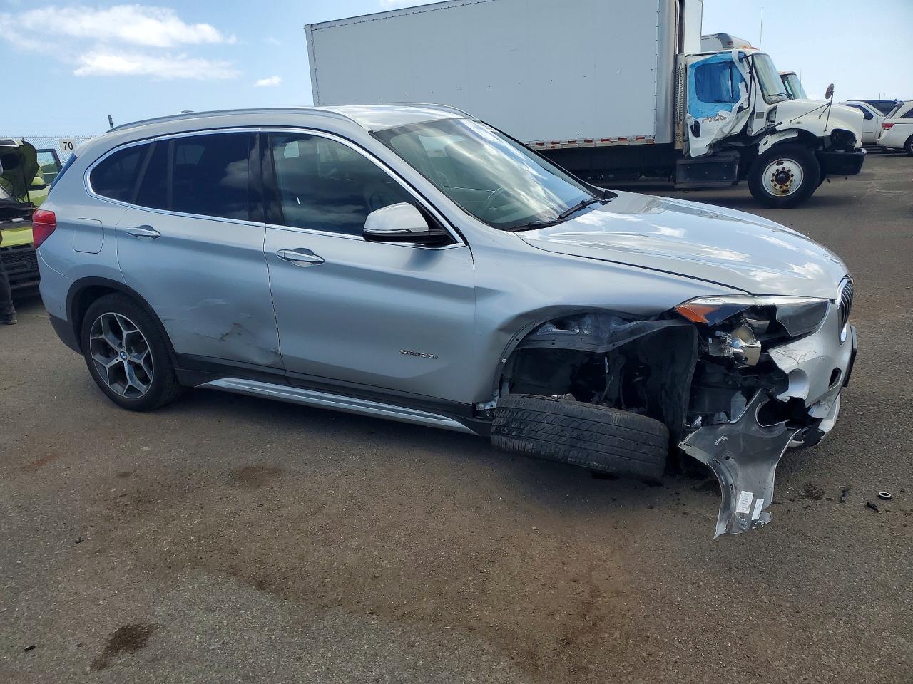 WBXHU7C32J5H39726 · 2018 BMW X1 · 4/13