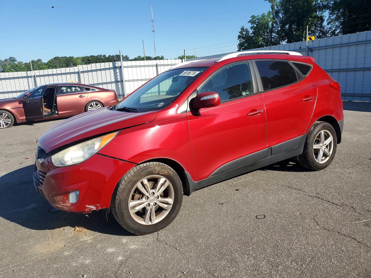 KM8JUCAC8DU558658 · 2013 HYUNDAI TUCSON