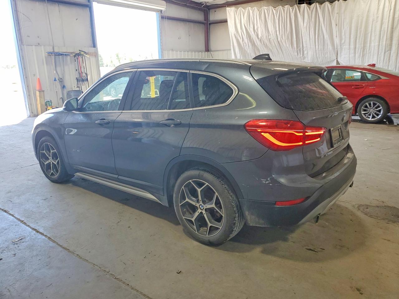 WBXHT3C36H5F68386 · 2017 BMW X1 · 2/12