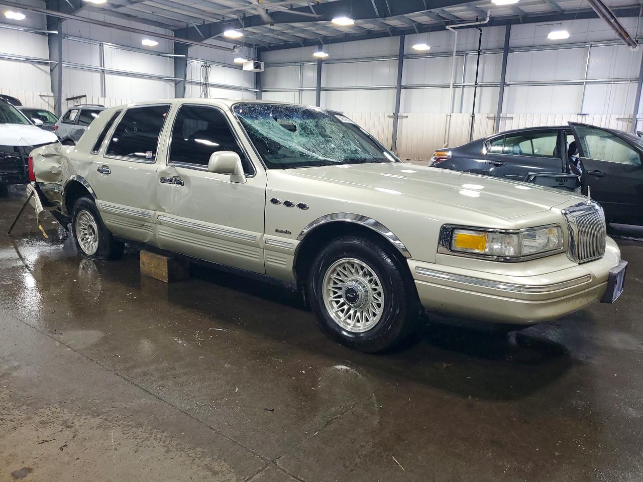 1LNLM81W0VY754975 · 1997 LINCOLN TOWN CAR · 4/12