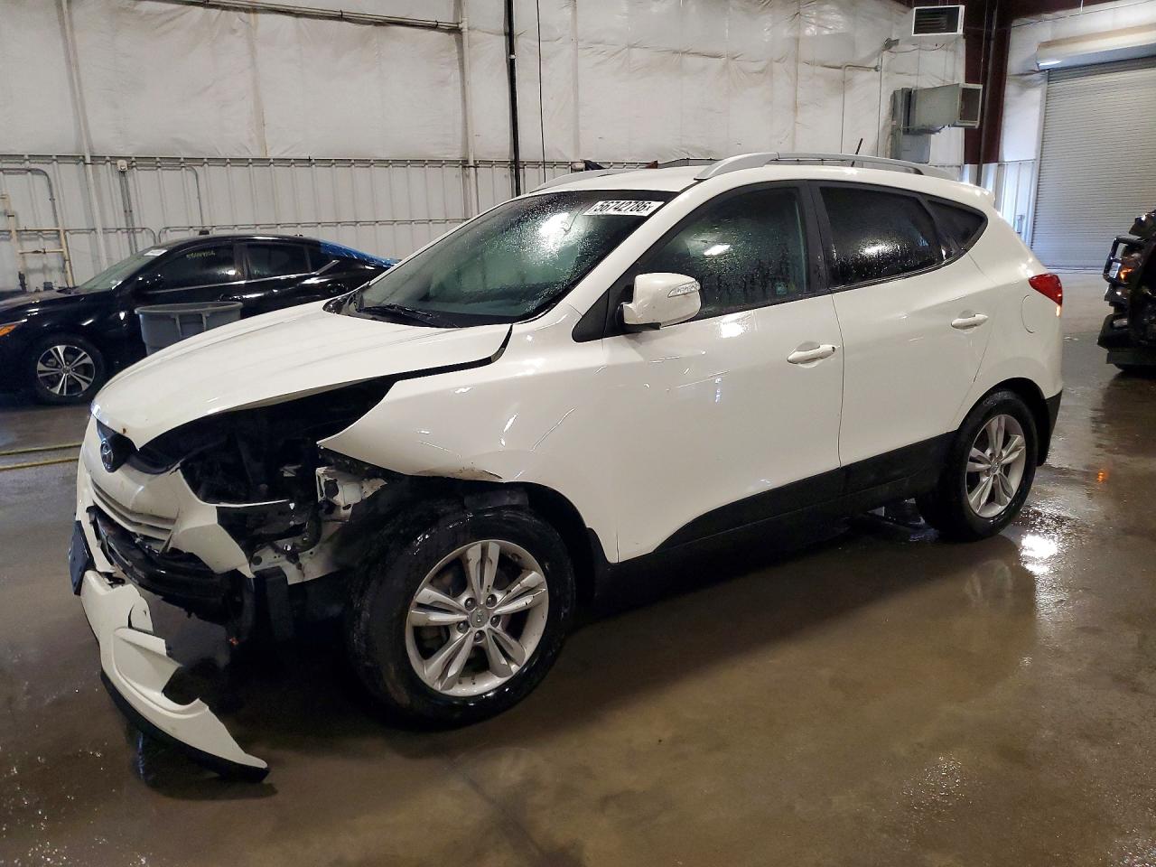 KM8JUCAC6DU604424 · 2013 HYUNDAI TUCSON