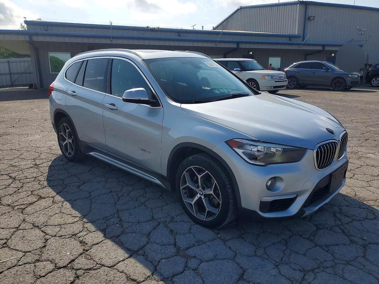 WBXHU7C30H5H34986 · 2017 BMW X1 · 4/12