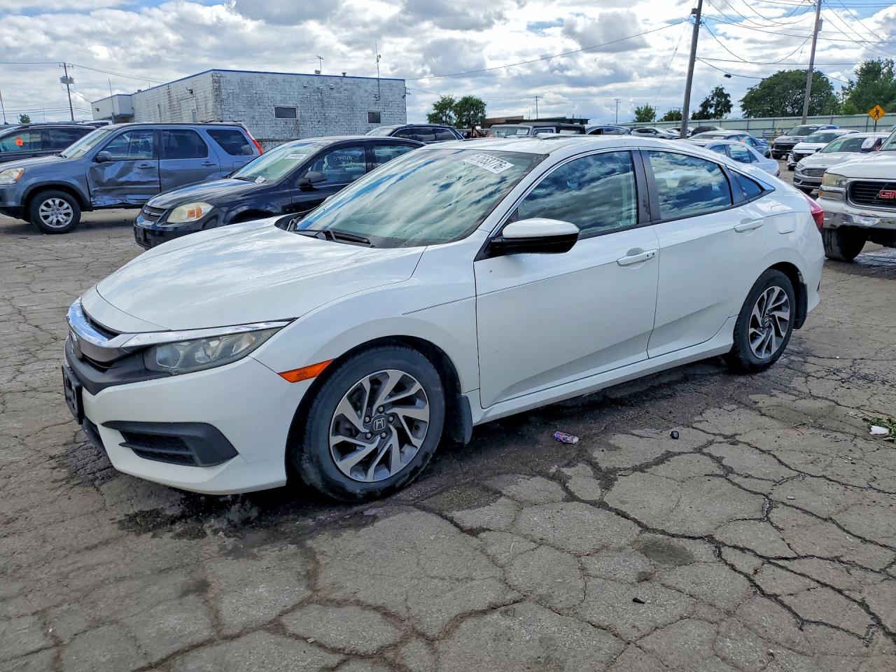 19XFC2F76JE034048 · 2018 HONDA CIVIC