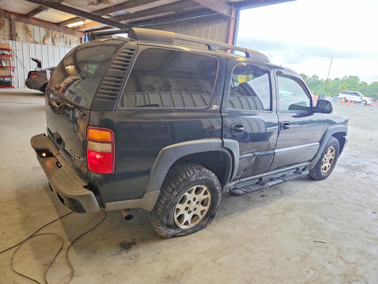 1GNEK13Z83R176690 · 2003 CHEVROLET TAHOE · 3/13