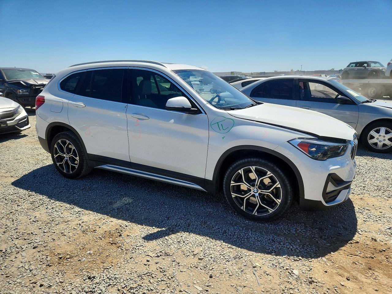 WBXJG7C02L5P75141 · 2020 BMW X1 · 4/13
