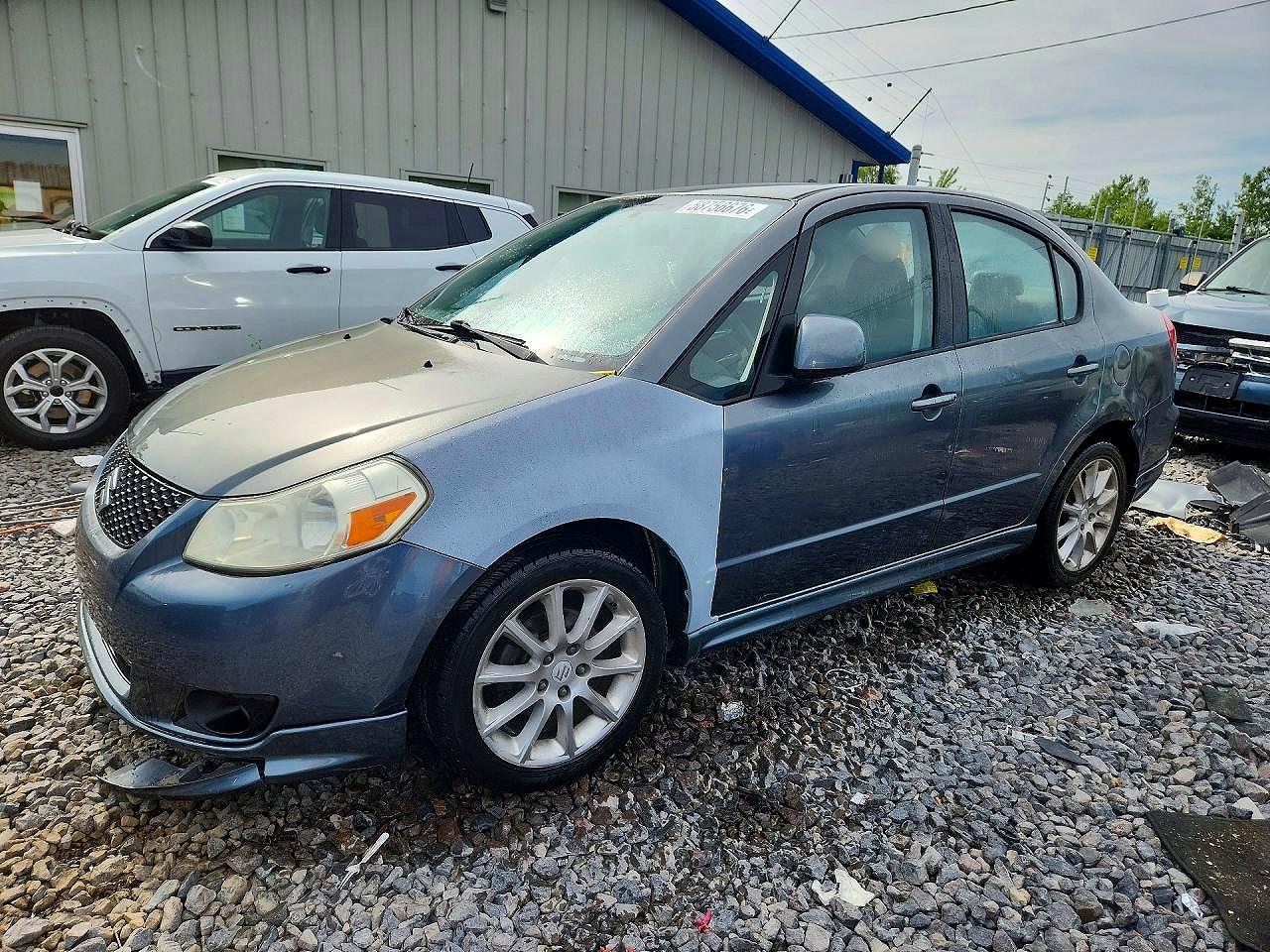 JS2YC414796200859 · 2009 SUZUKI SX4