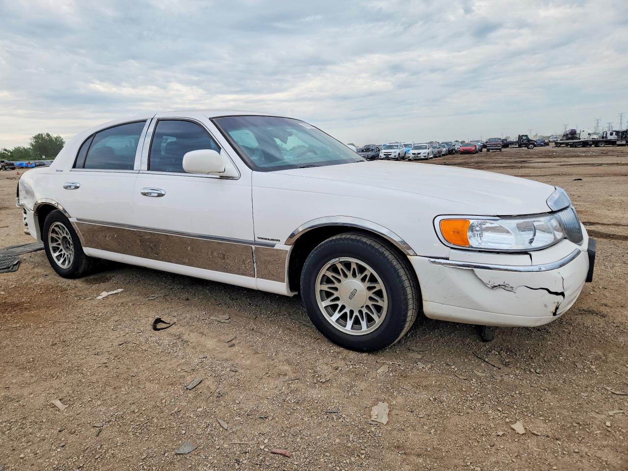 1LNHM82WX1Y652890 · 2001 LINCOLN TOWN CAR · 4/12