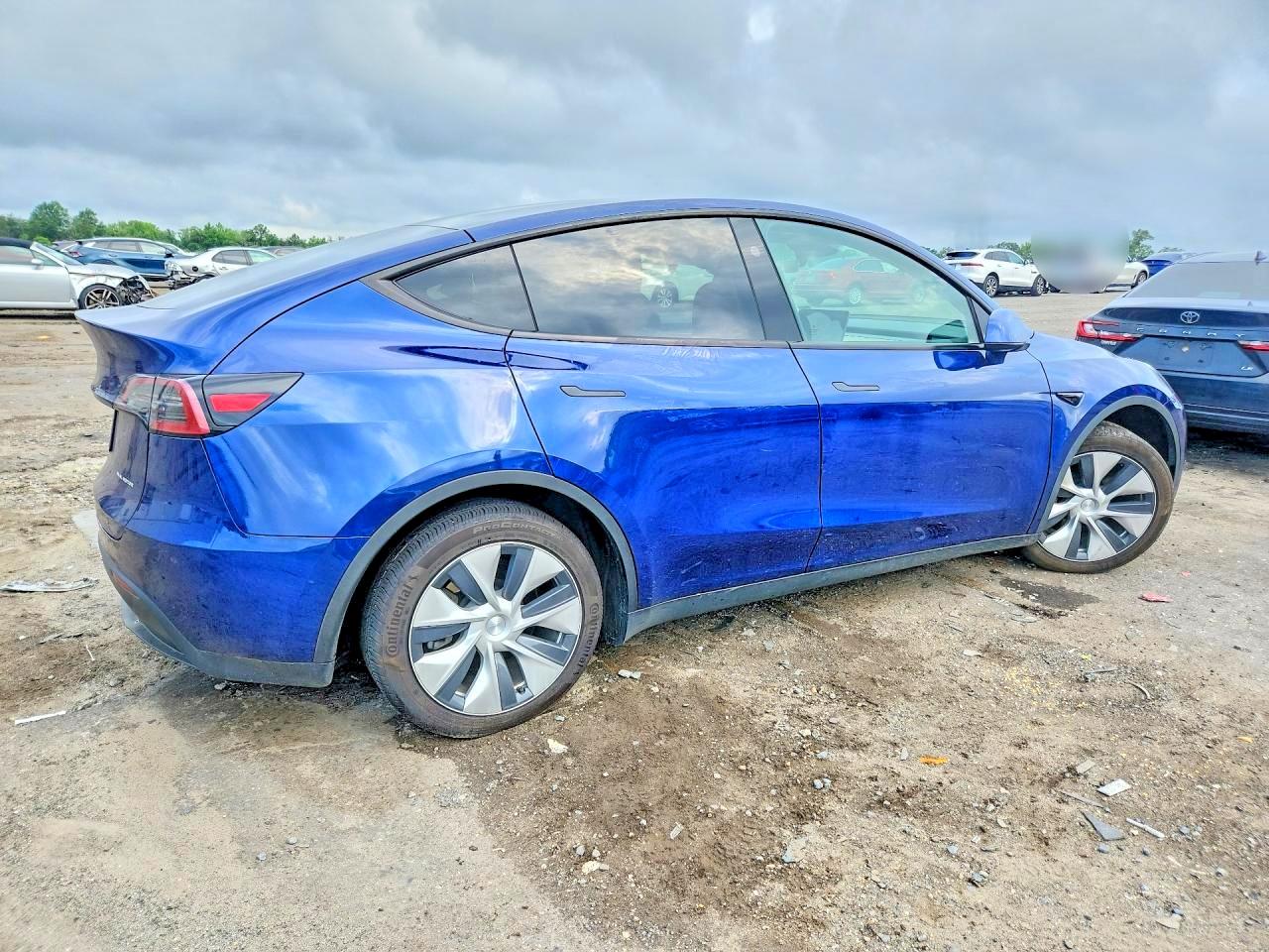 7SAYGAEE4PF879140 · 2023 TESLA MODEL Y · 3/13