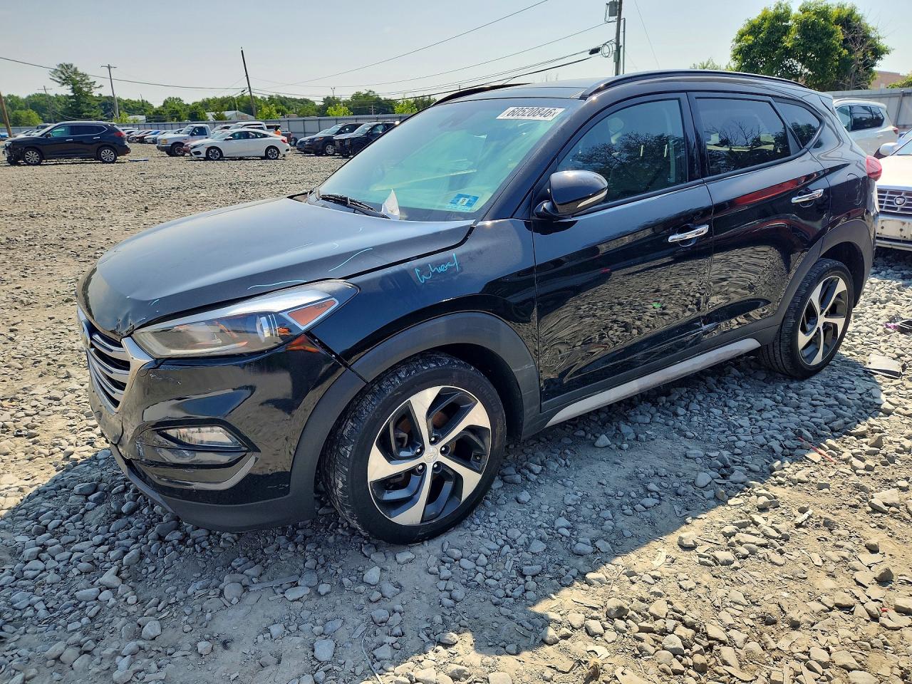 KM8J3CA25JU835563 · 2018 HYUNDAI TUCSON