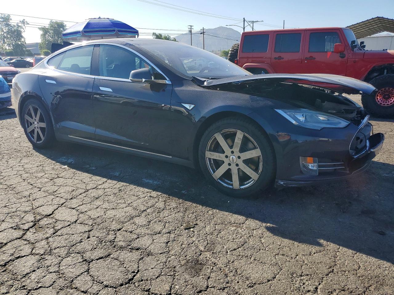 5YJSA1S17EFP32698 · 2014 TESLA MODEL S · 4/12