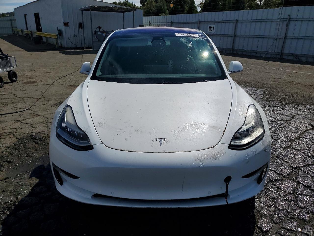 5YJ3E1EA1JF013218 · 2018 TESLA MODEL 3 · 5/12