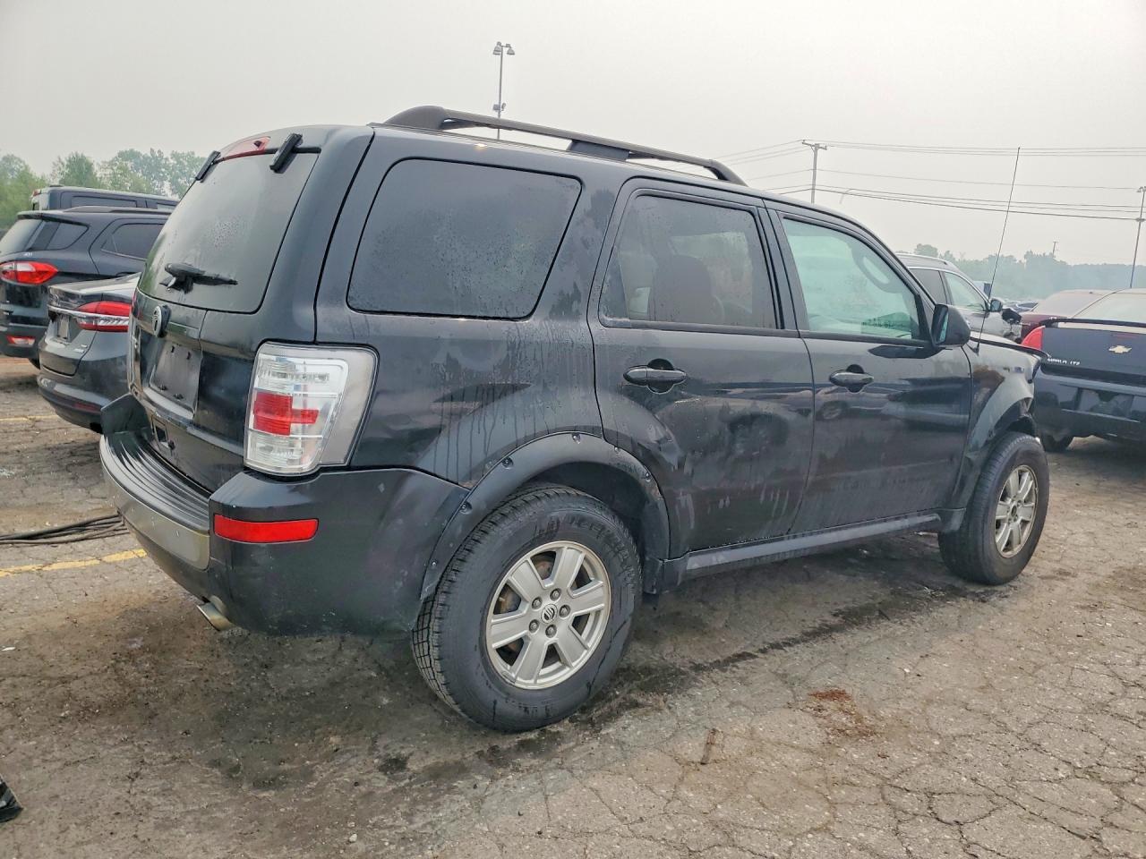 4M2CN8B7XBKJ06089 · 2011 MERCURY MARINER · 3/14