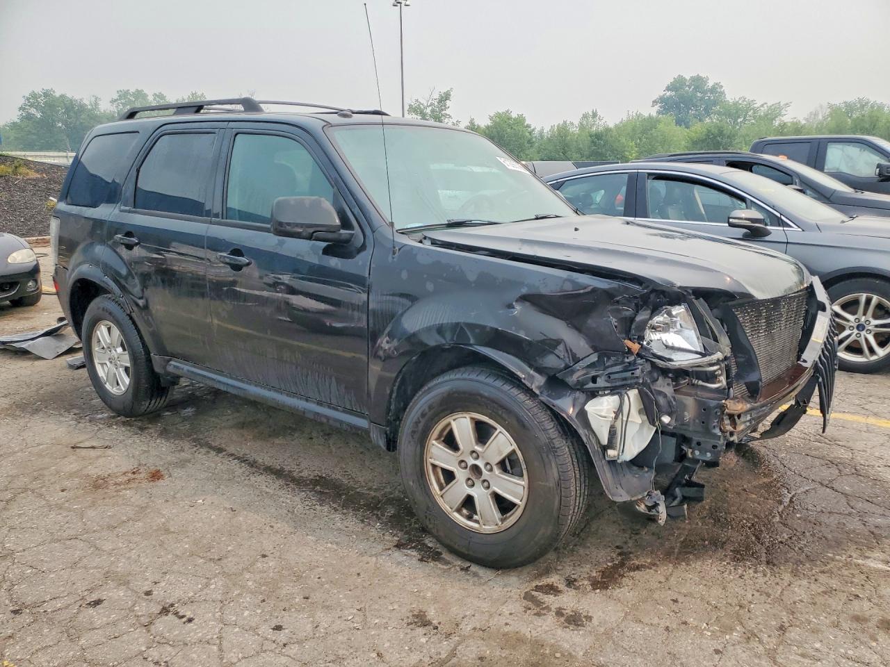 4M2CN8B7XBKJ06089 · 2011 MERCURY MARINER · 4/14