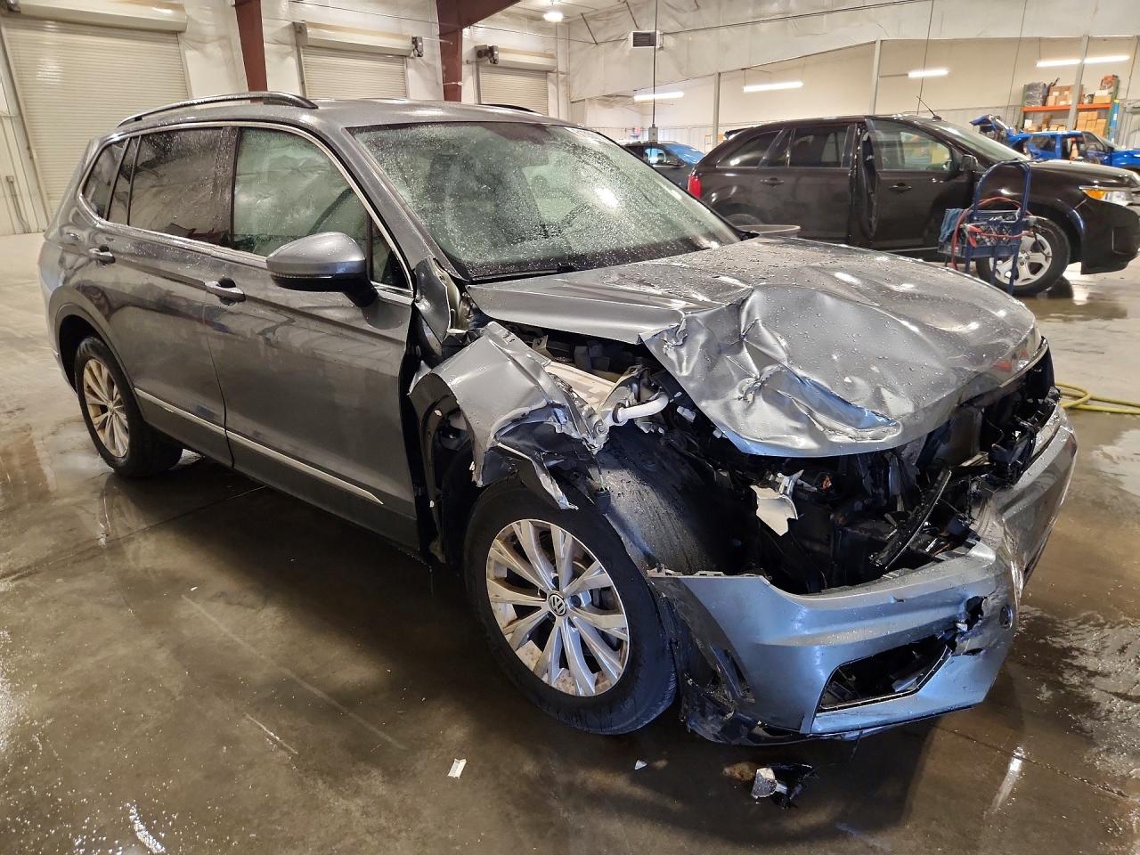 3VV2B7AX1JM105962 · 2018 VOLKSWAGEN TIGUAN · 4/14