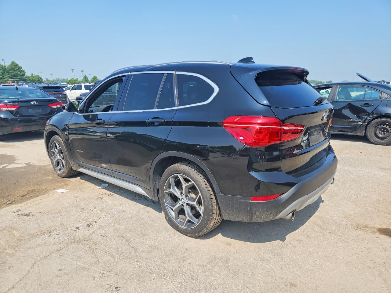 WBXHT3C37G5E50328 · 2016 BMW X1 · 2/13