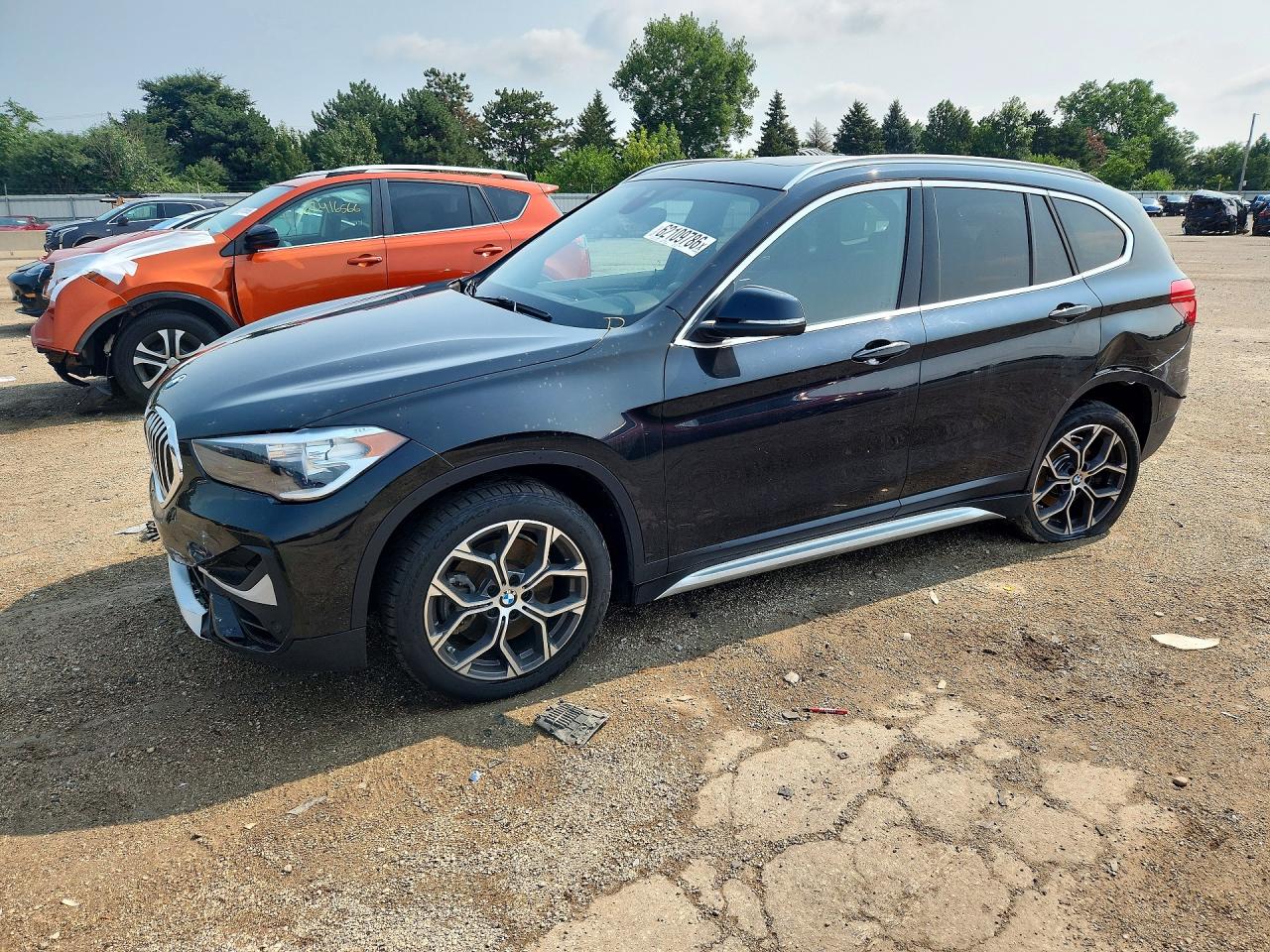 WBXJG7C03M5U23123 · 2021 BMW X1