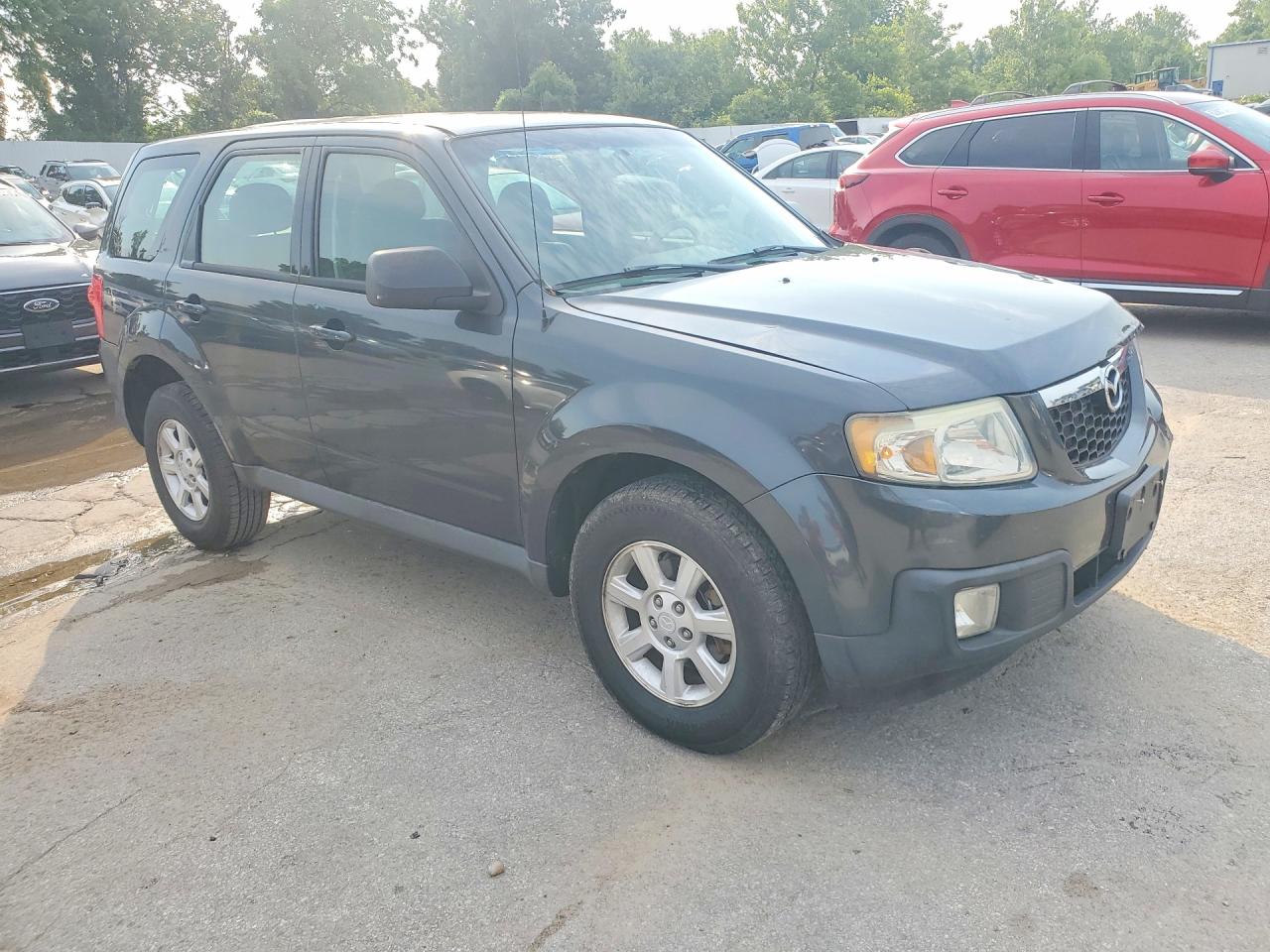 4F2CY0C76AKM02111 · 2010 MAZDA TRIBUTE · 4/13