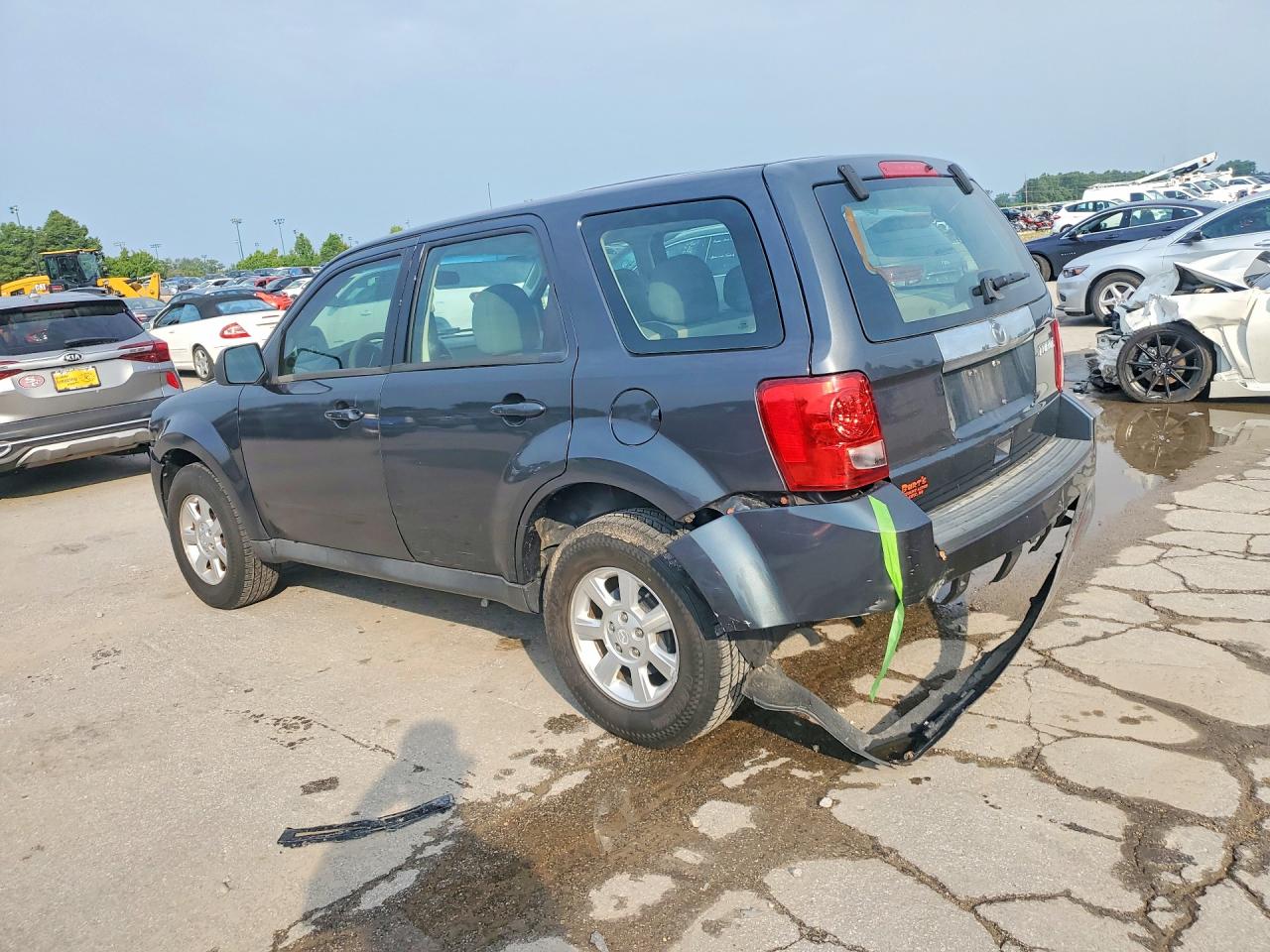 4F2CY0C76AKM02111 · 2010 MAZDA TRIBUTE · 2/13