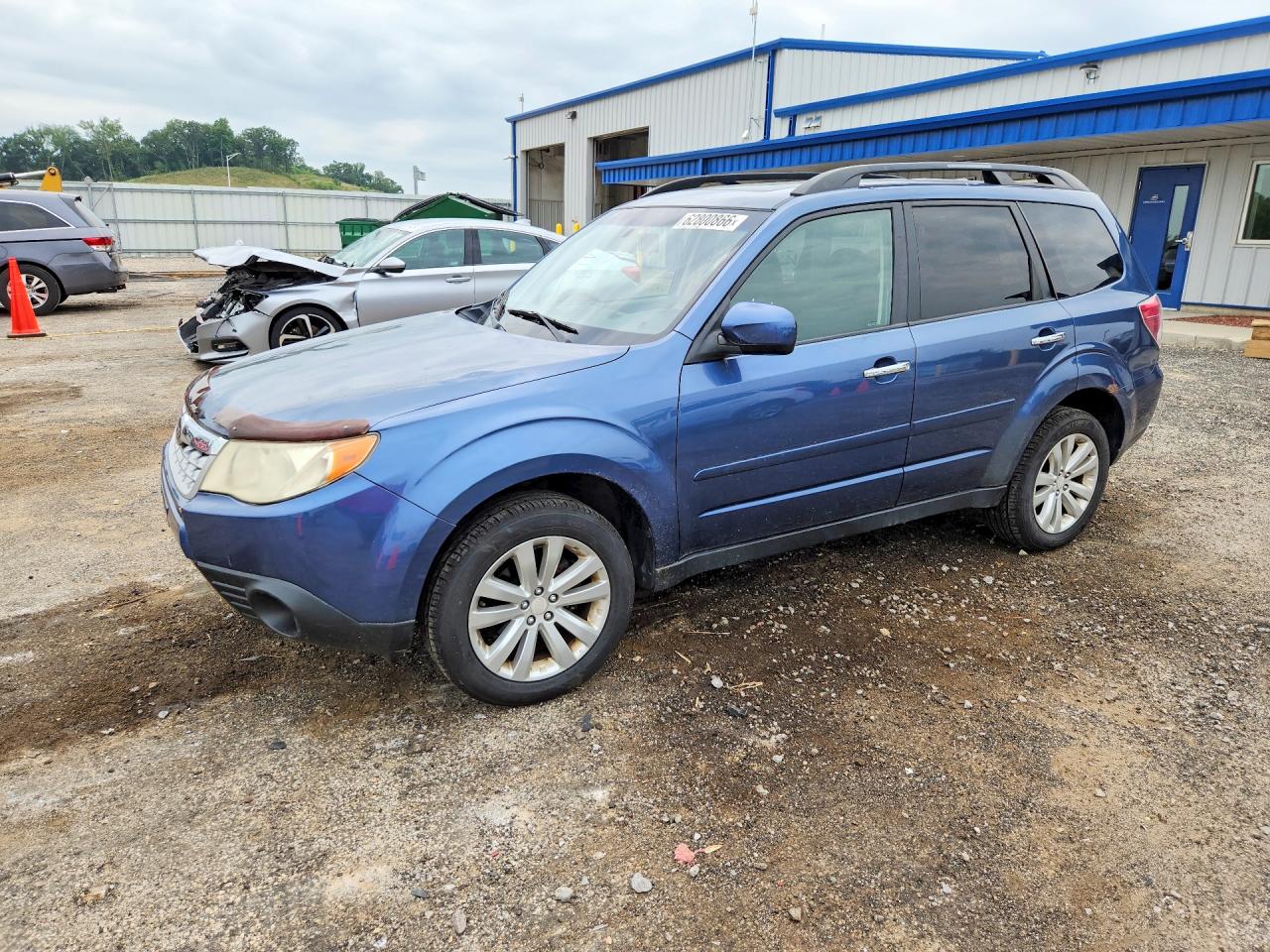 JF2SHBDC1BH725968 · 2011 SUBARU FORESTER