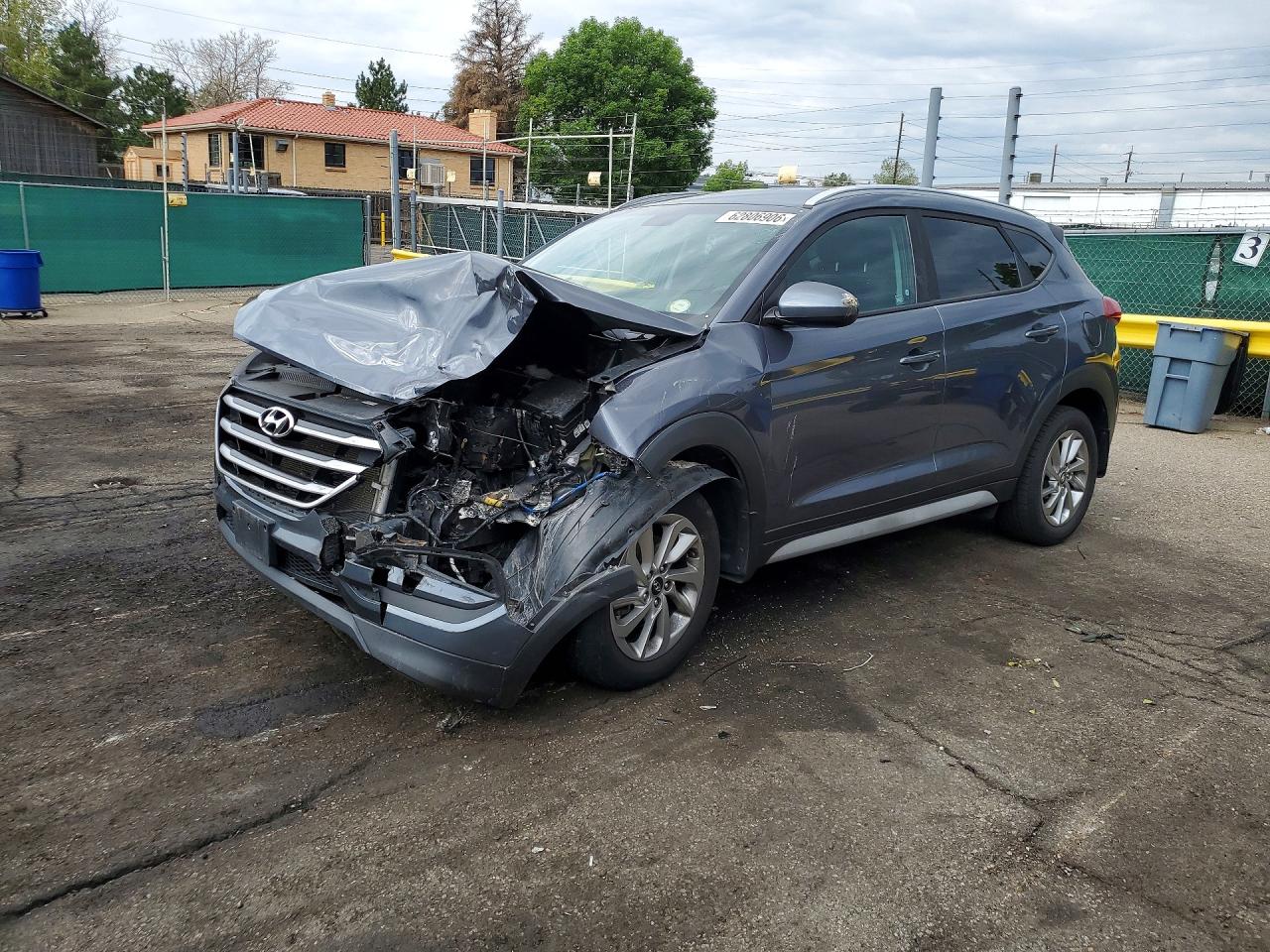 KM8J3CA45JU608357 · 2018 HYUNDAI TUCSON