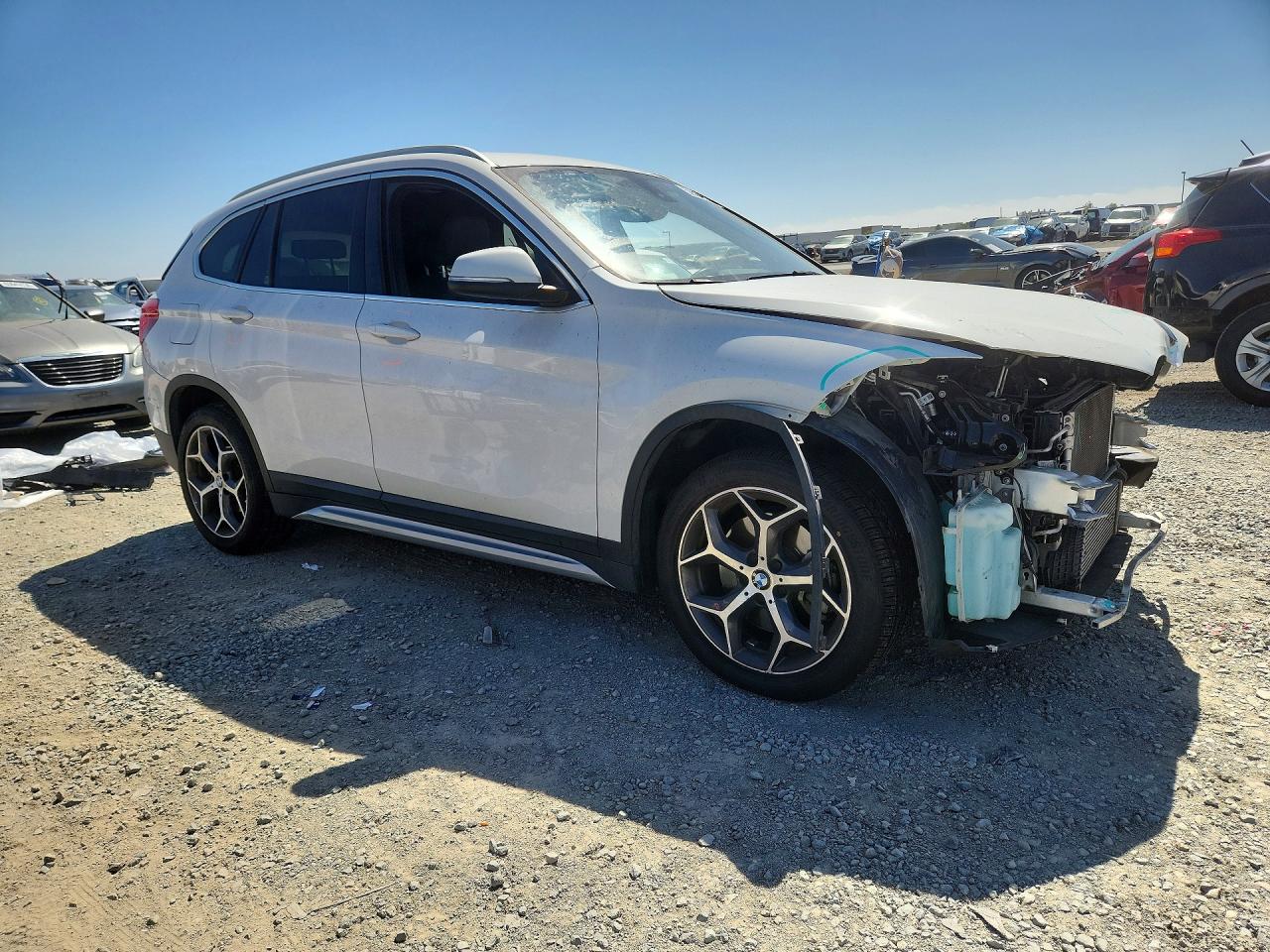 WBXHU7C35J5L08889 · 2018 BMW X1 · 4/14