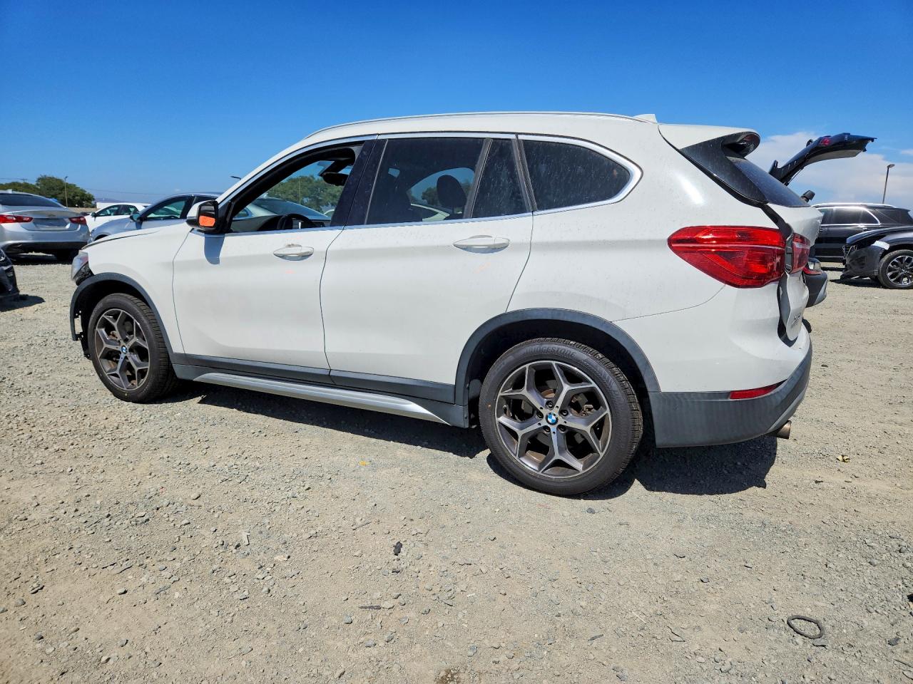 WBXHU7C35J5L08889 · 2018 BMW X1 · 2/14