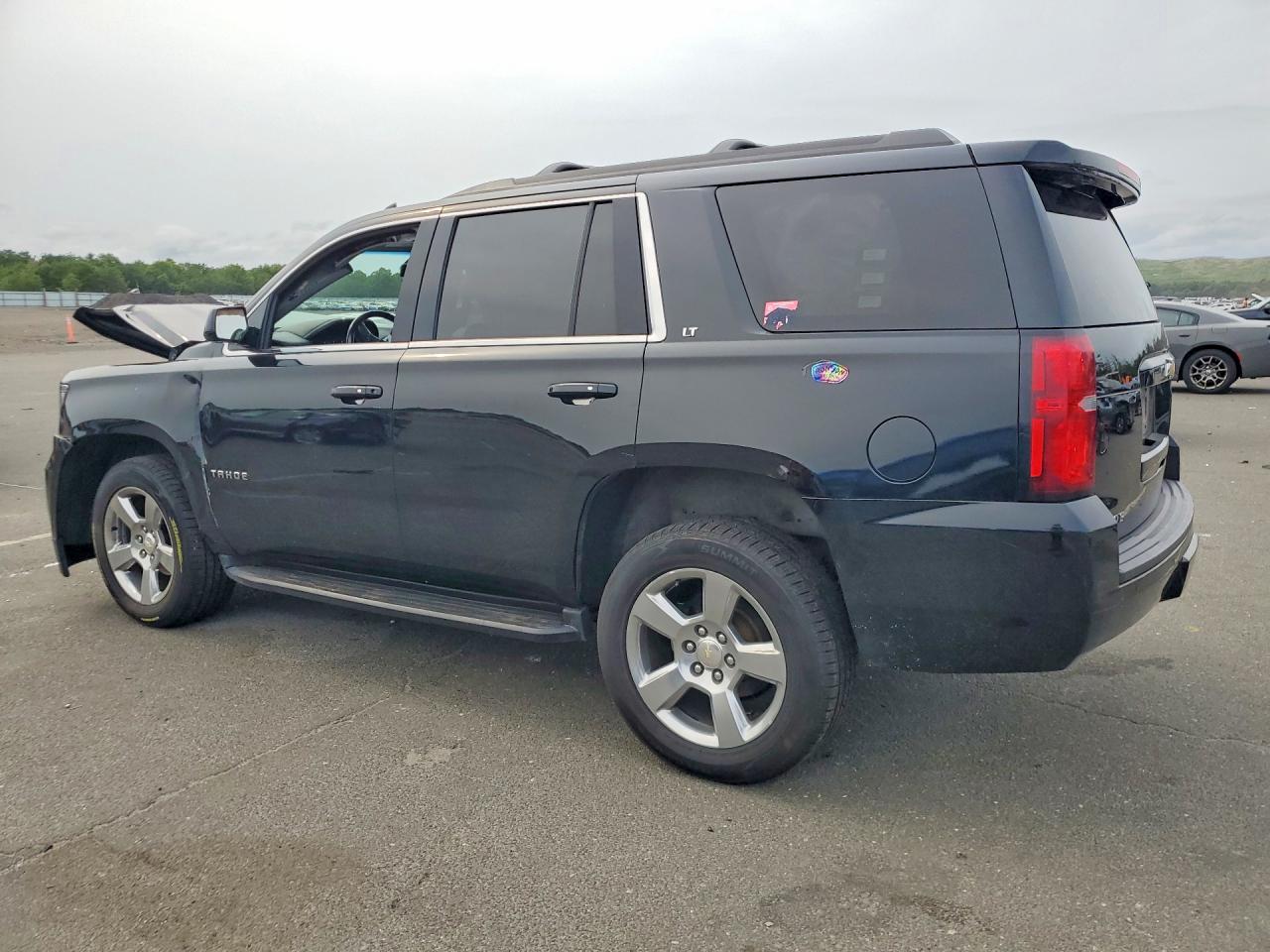 1GNSKBKC4KR107984 · 2019 CHEVROLET TAHOE · 2/13