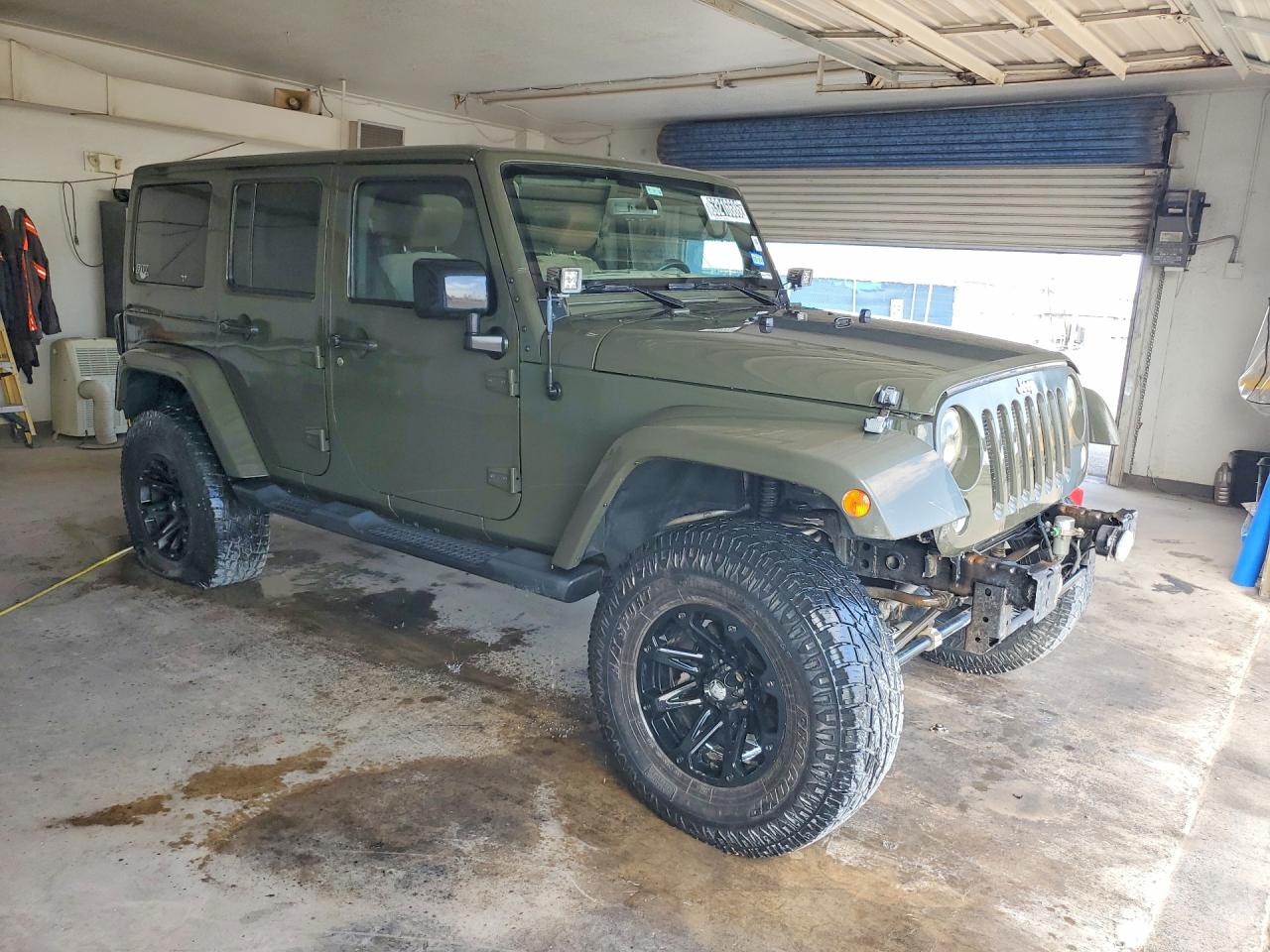 1C4BJWEG9FL723142 · 2015 JEEP WRANGLER UNLIMITED · 4/14