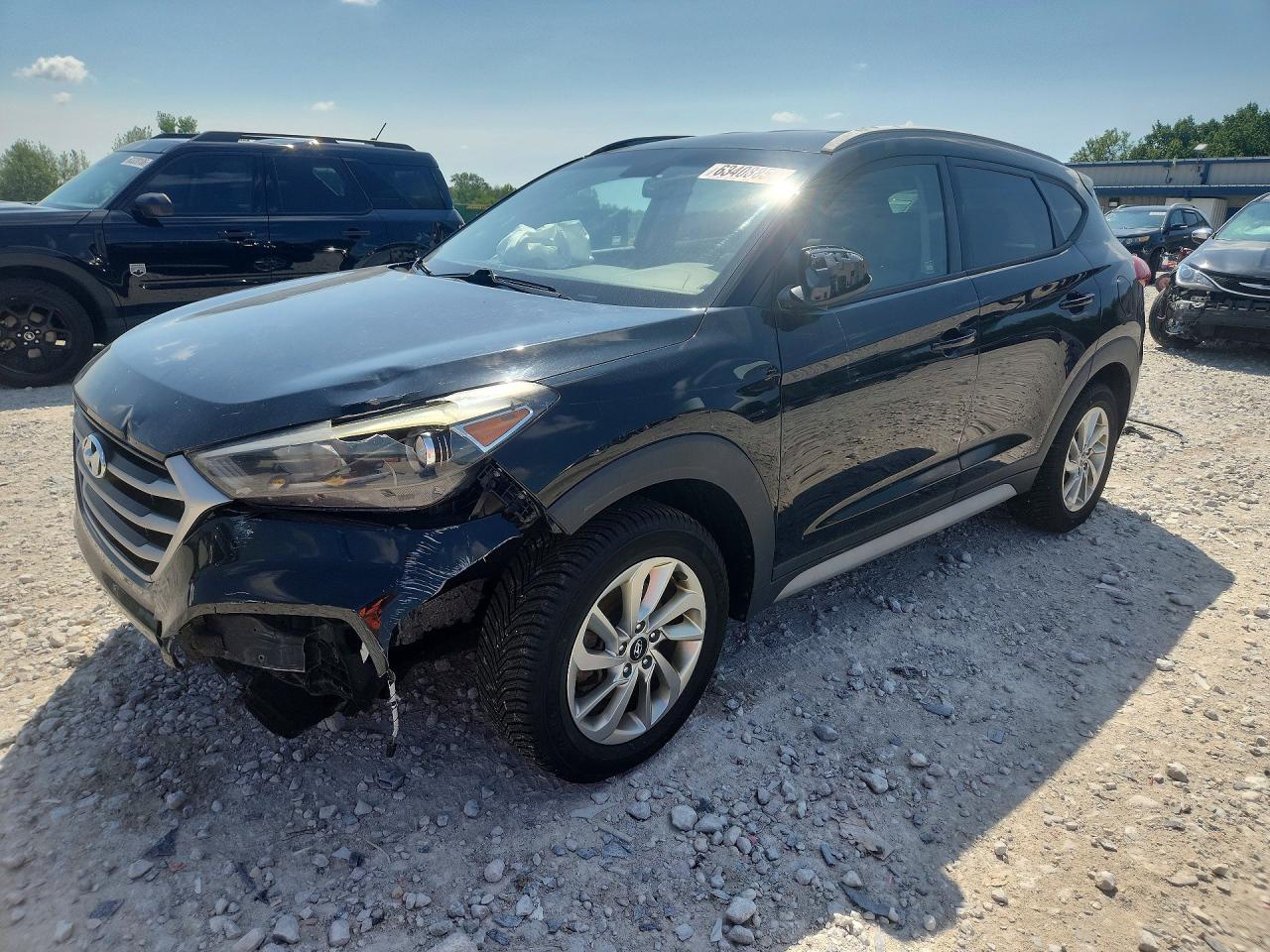 KM8J3CA40JU674637 · 2018 HYUNDAI TUCSON