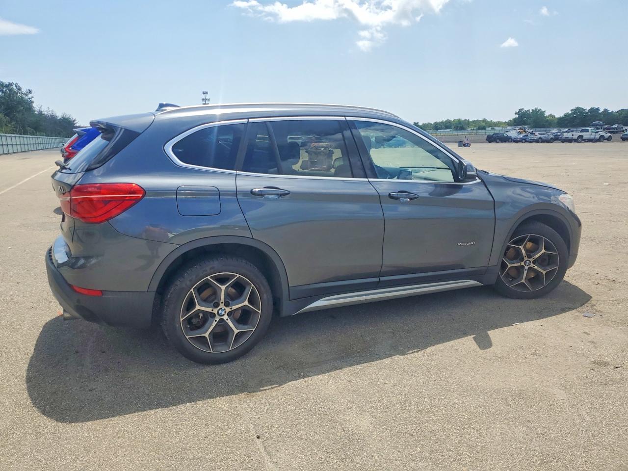 WBXHT3C38G5E53254 · 2016 BMW X1 · 3/13