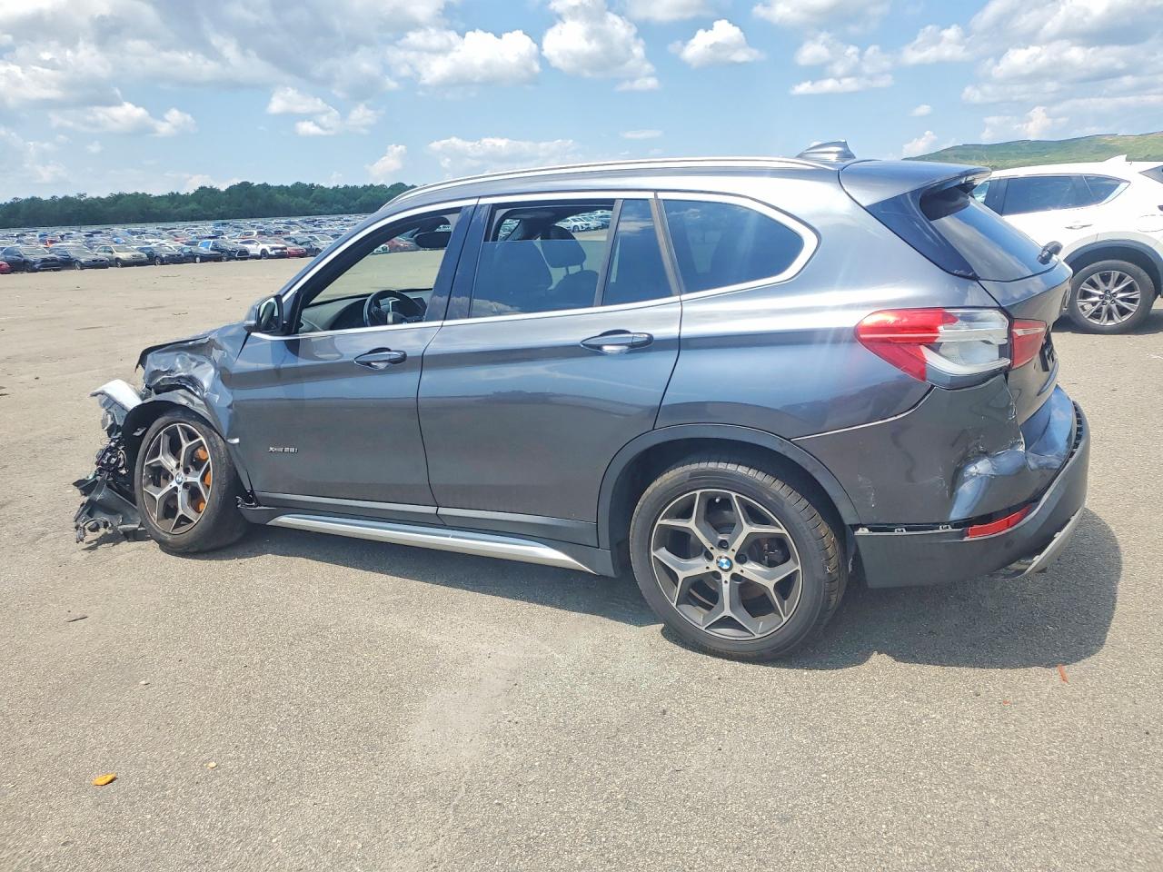 WBXHT3C38G5E53254 · 2016 BMW X1 · 2/13