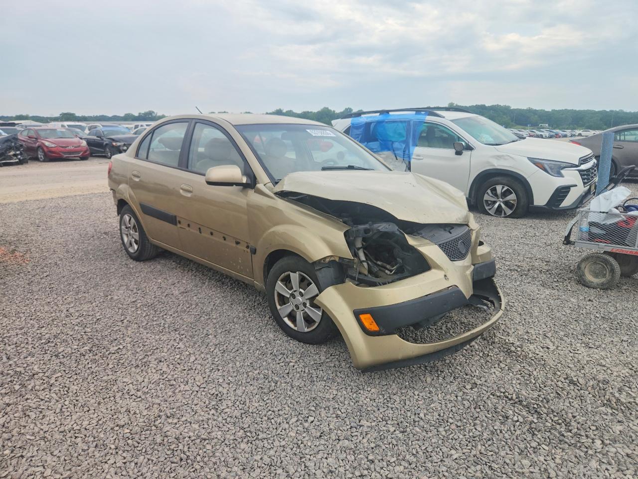 KNADE123266111751 · 2006 KIA RIO · 4/12