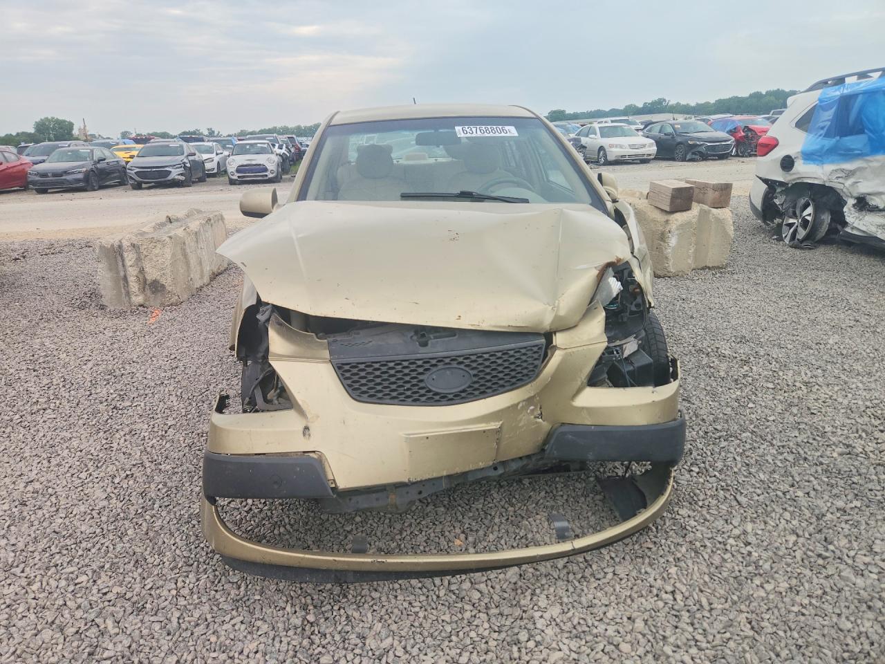 KNADE123266111751 · 2006 KIA RIO · 5/12